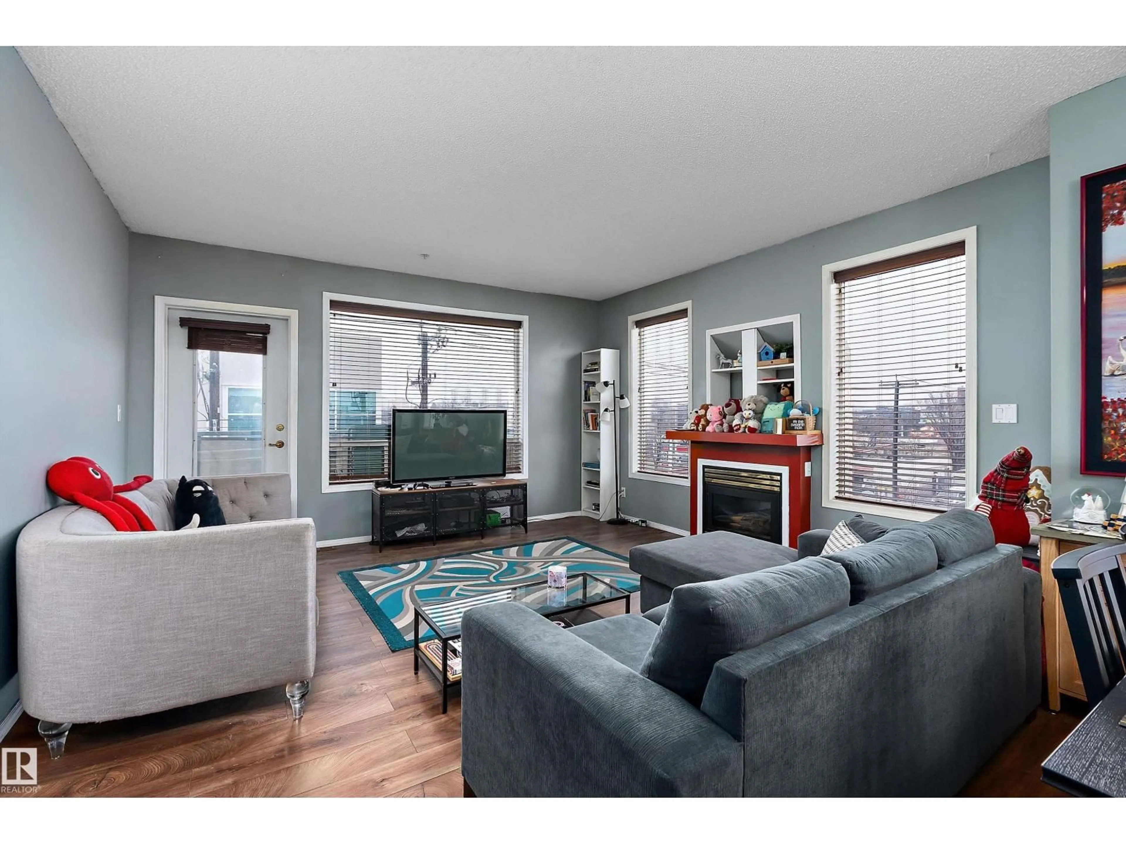 Living room with furniture, wood/laminate floor for #301 - 8108 109 ST NW, Edmonton Alberta T6G2V7