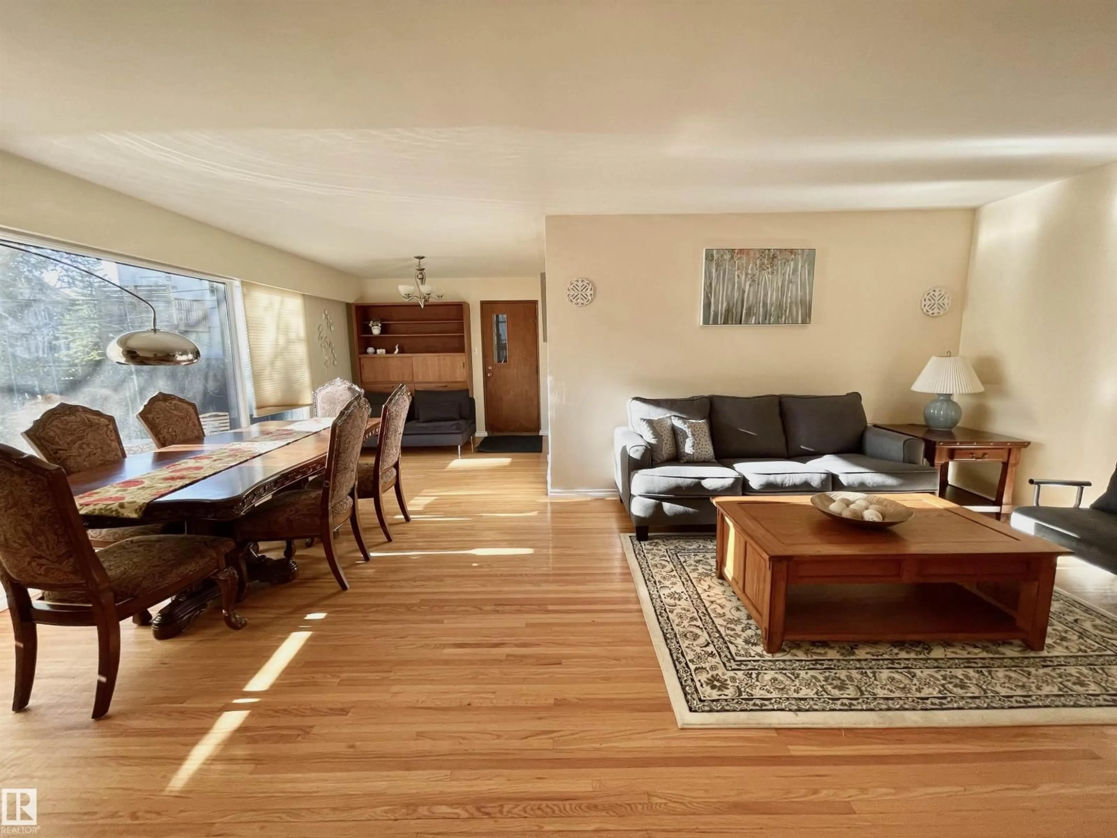 Living room with furniture, wood/laminate floor for 11681 72 AV, Edmonton Alberta T6G0B9