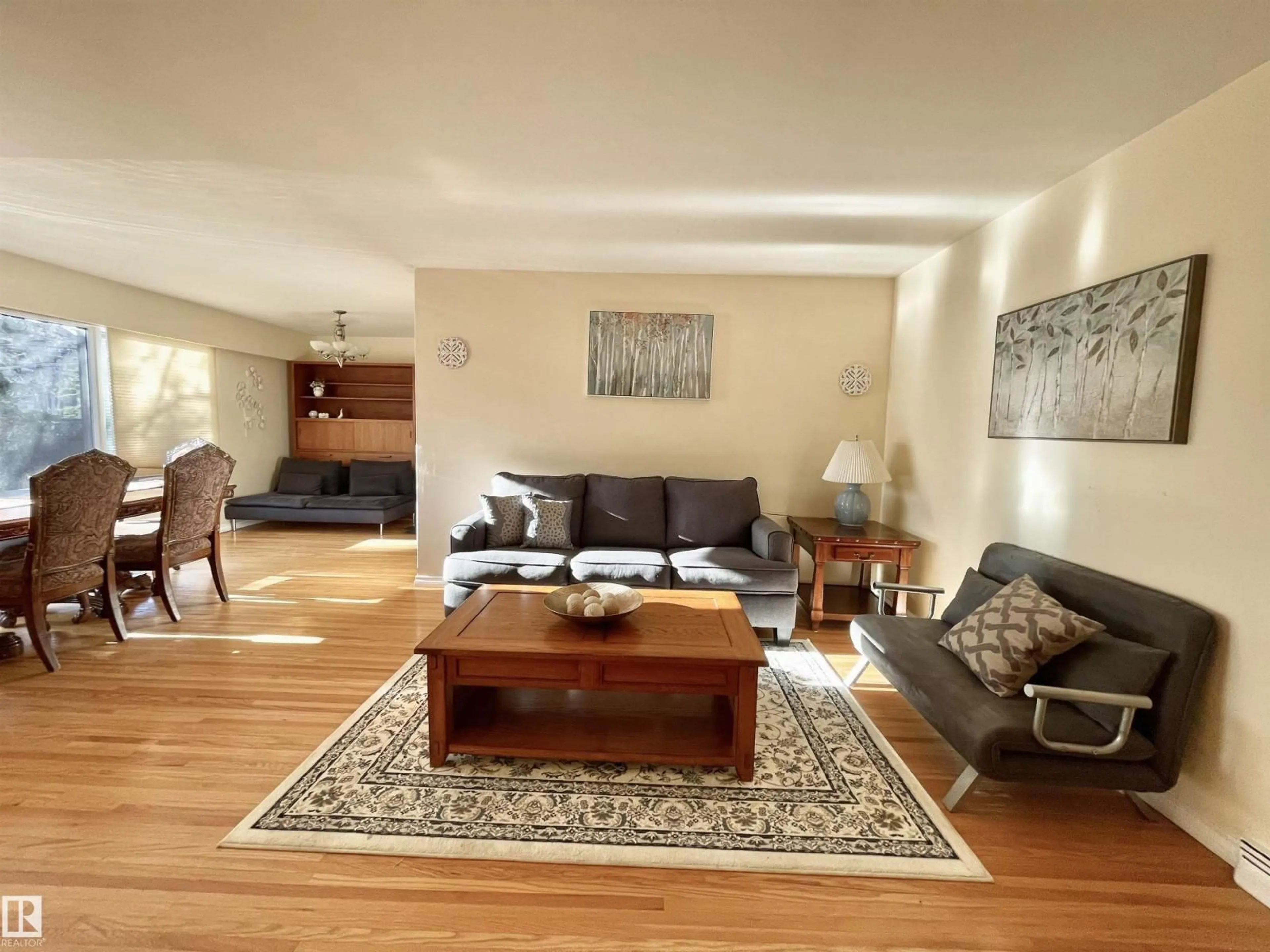 Living room with furniture, wood/laminate floor for 11681 72 AV, Edmonton Alberta T6G0B9