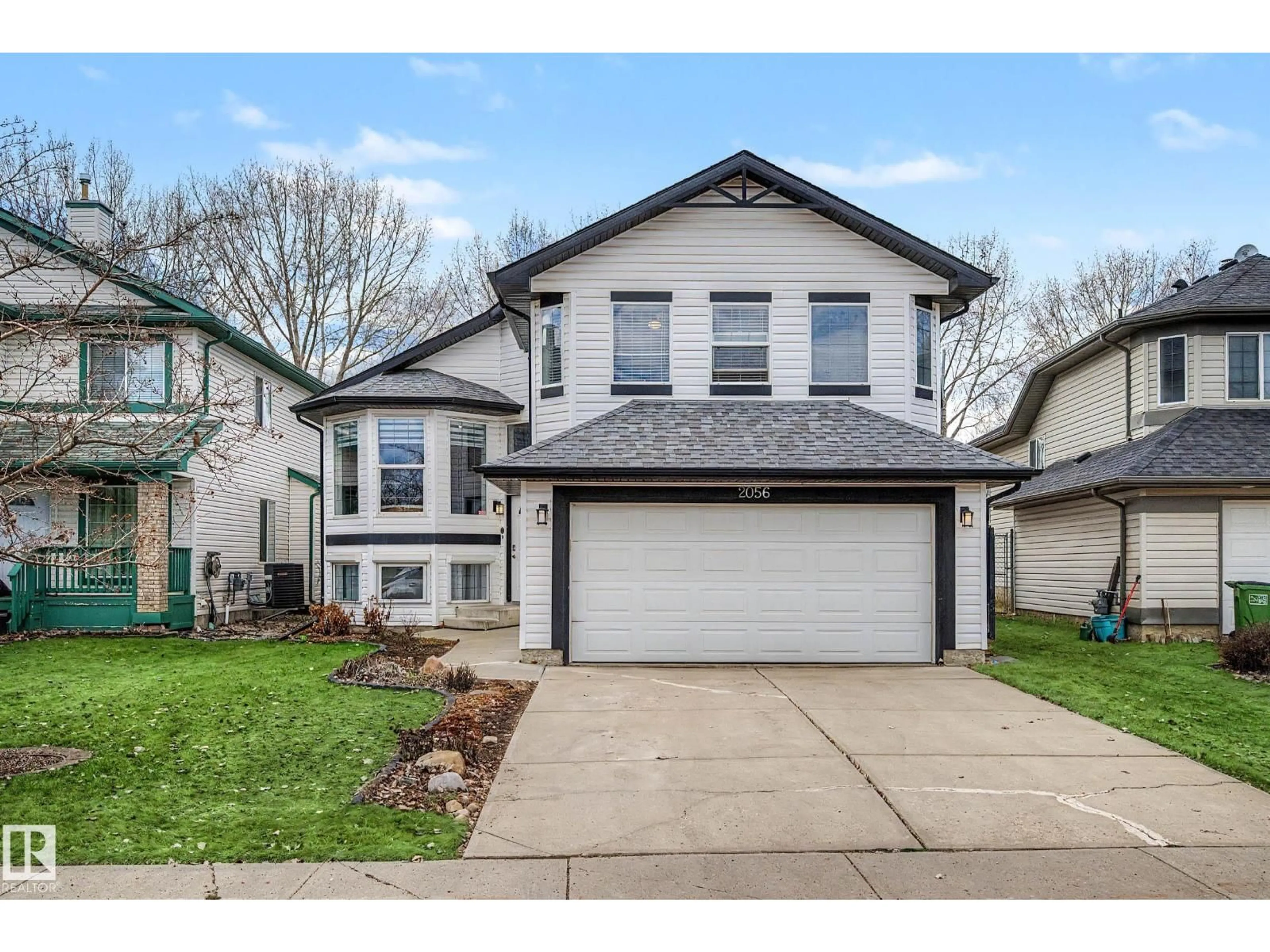 Home with vinyl exterior material, street for 2056 BRENNAN CR, Edmonton Alberta T5T6S4