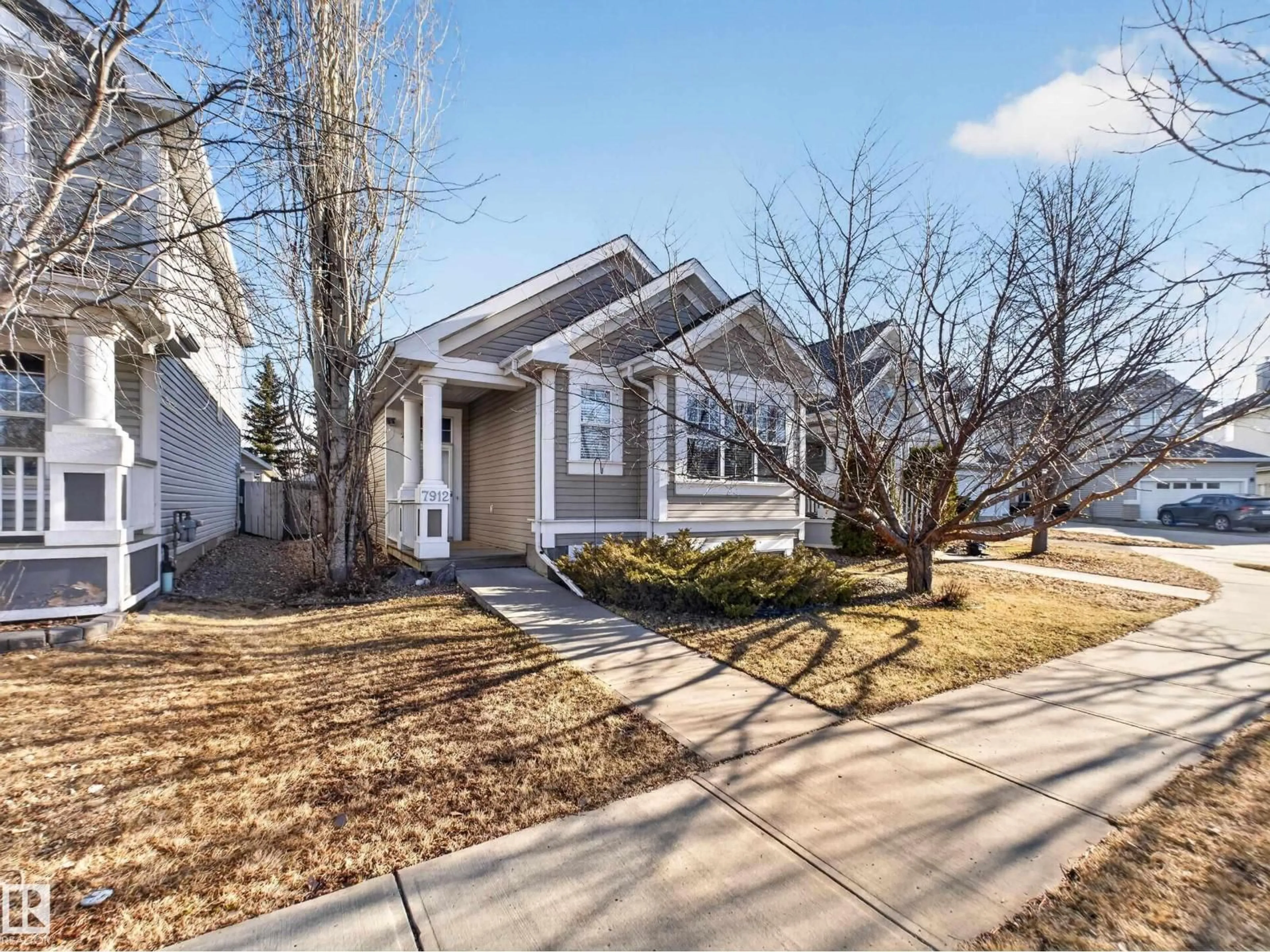 Home with vinyl exterior material, street for 7912 10 AV, Edmonton Alberta T6X1E7