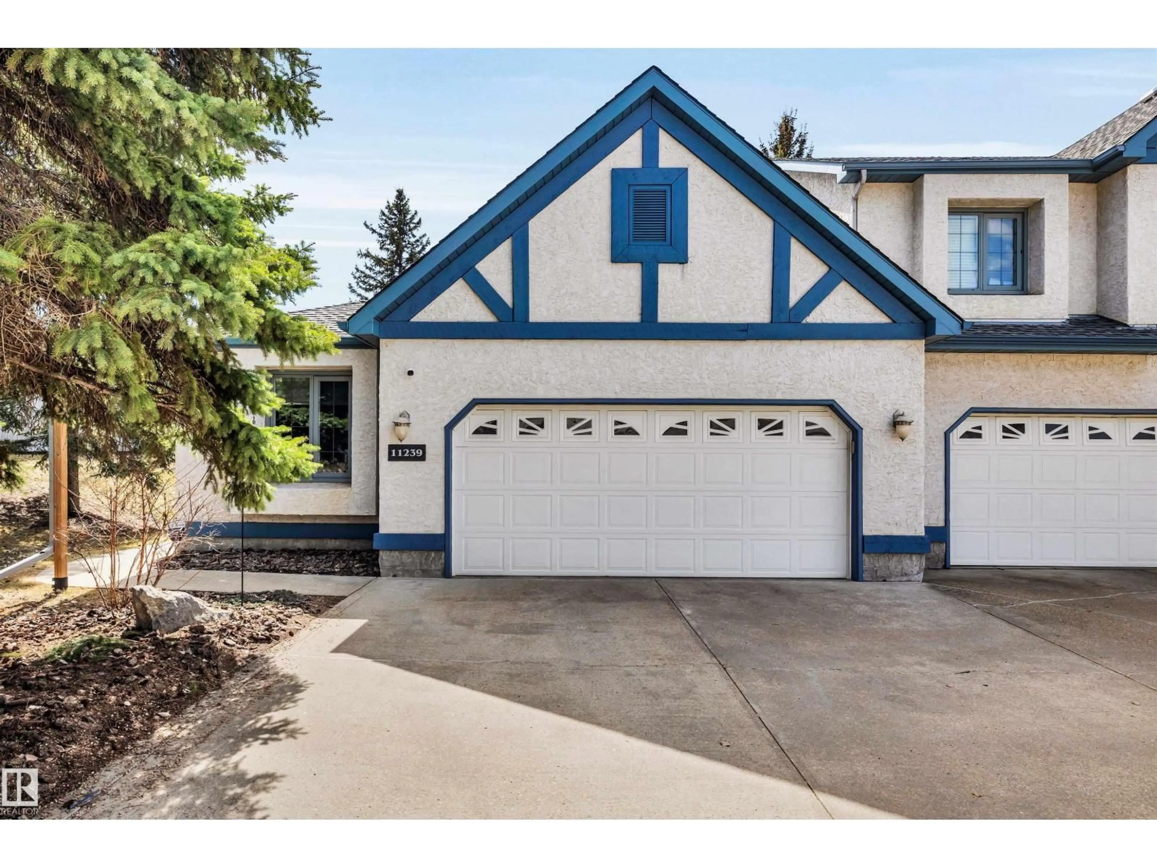 Home with vinyl exterior material, street for 11239 12 AV, Edmonton Alberta T6J6V6