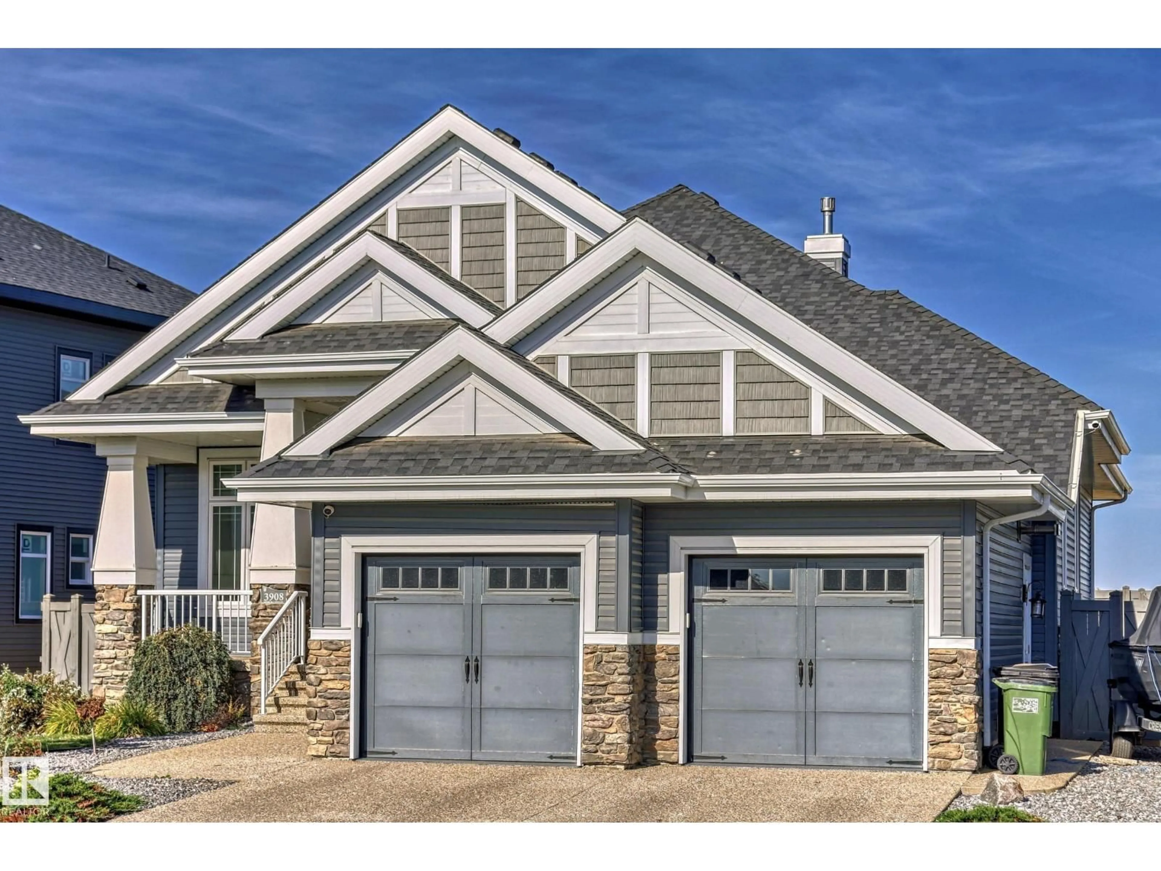 Home with vinyl exterior material, street for NW - 3908 GINSBURG CR, Edmonton Alberta T5T4V2