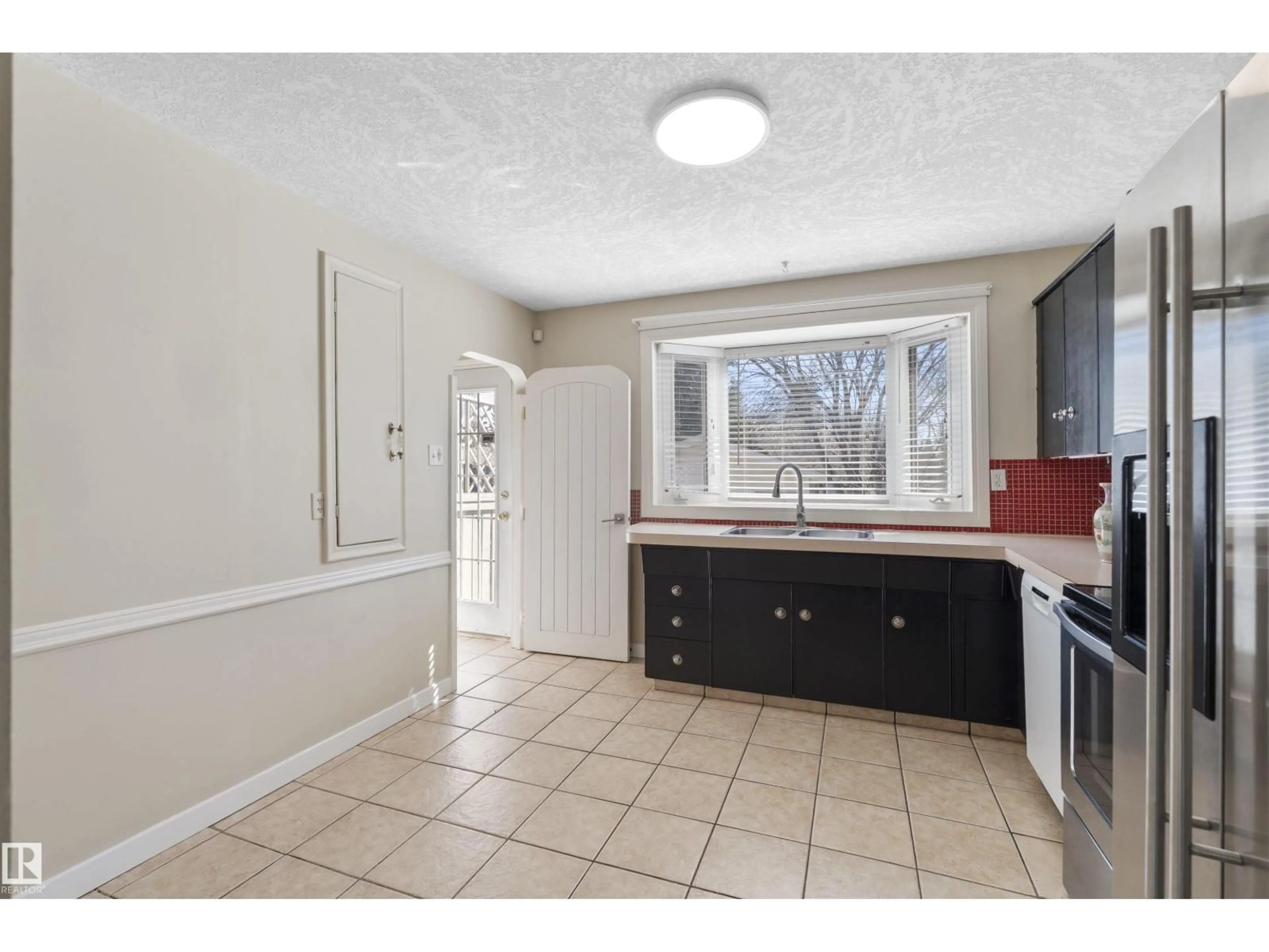 Standard kitchen, ceramic/tile floor for 10715 135 ST, Edmonton Alberta T5M1J7
