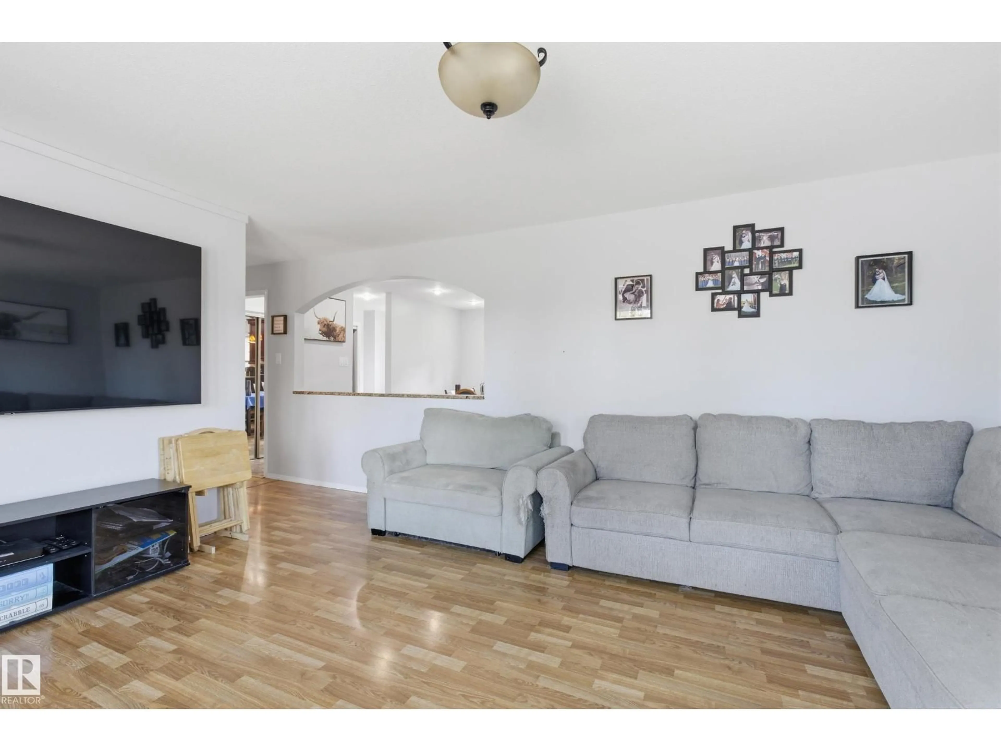Living room with furniture, wood/laminate floor for 4503 48 AV, Onoway Alberta T0E1V0