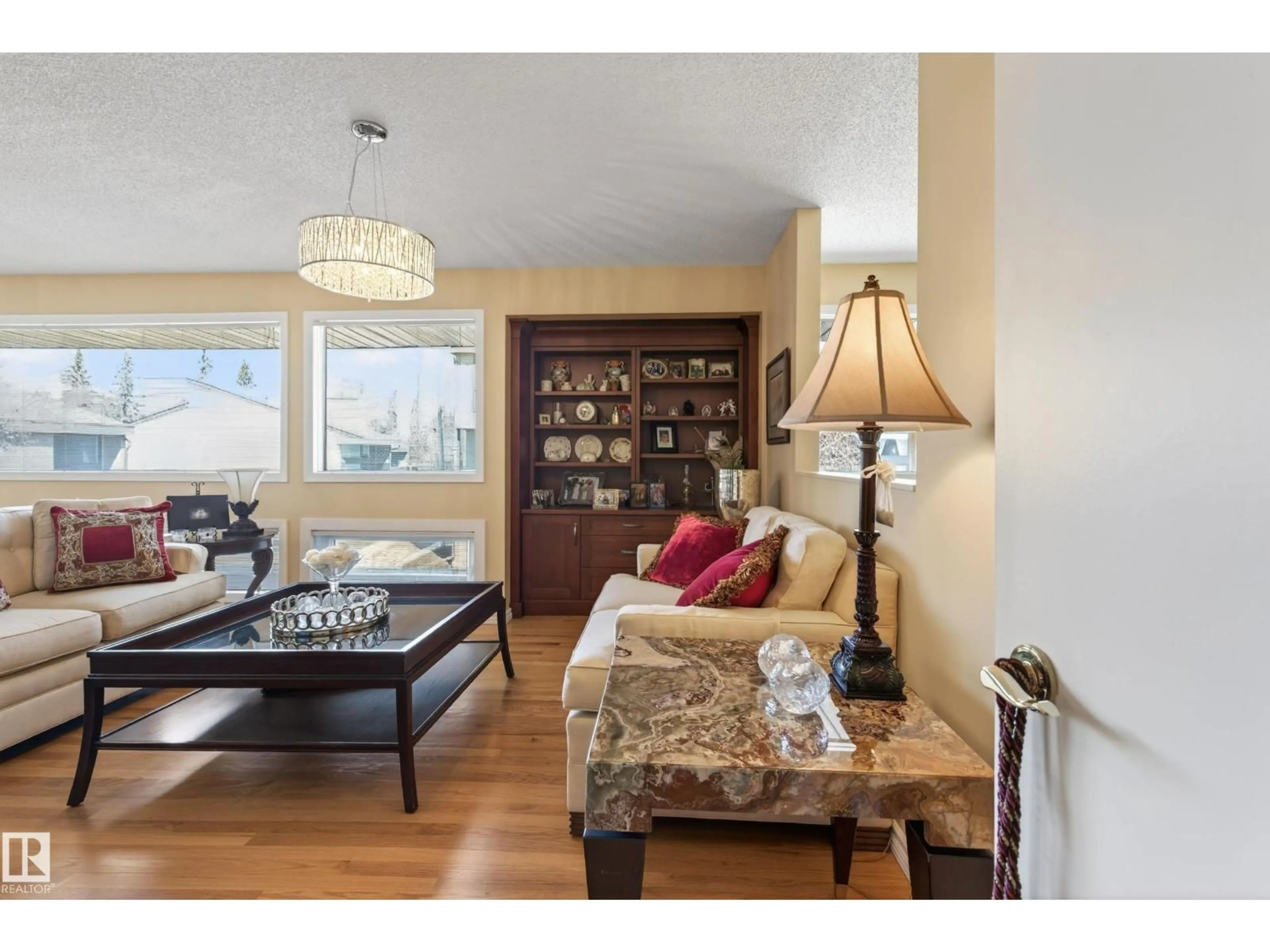 Living room with furniture, wood/laminate floor for 76 WILLOW WY, Edmonton Alberta T5T1C8