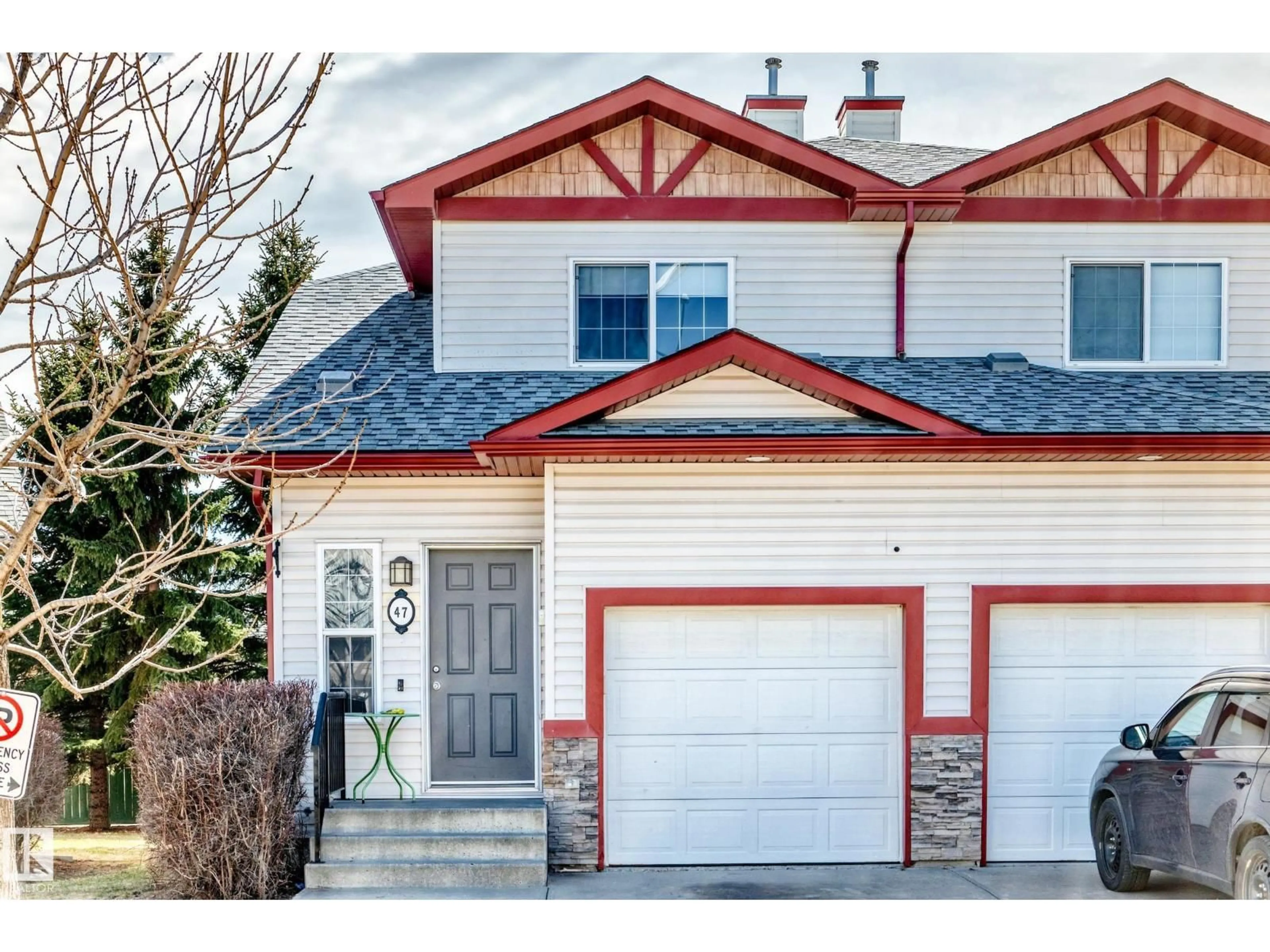 Home with vinyl exterior material, street for 15 - 47 WOODSMERE CL, Fort Saskatchewan Alberta T8L4S2