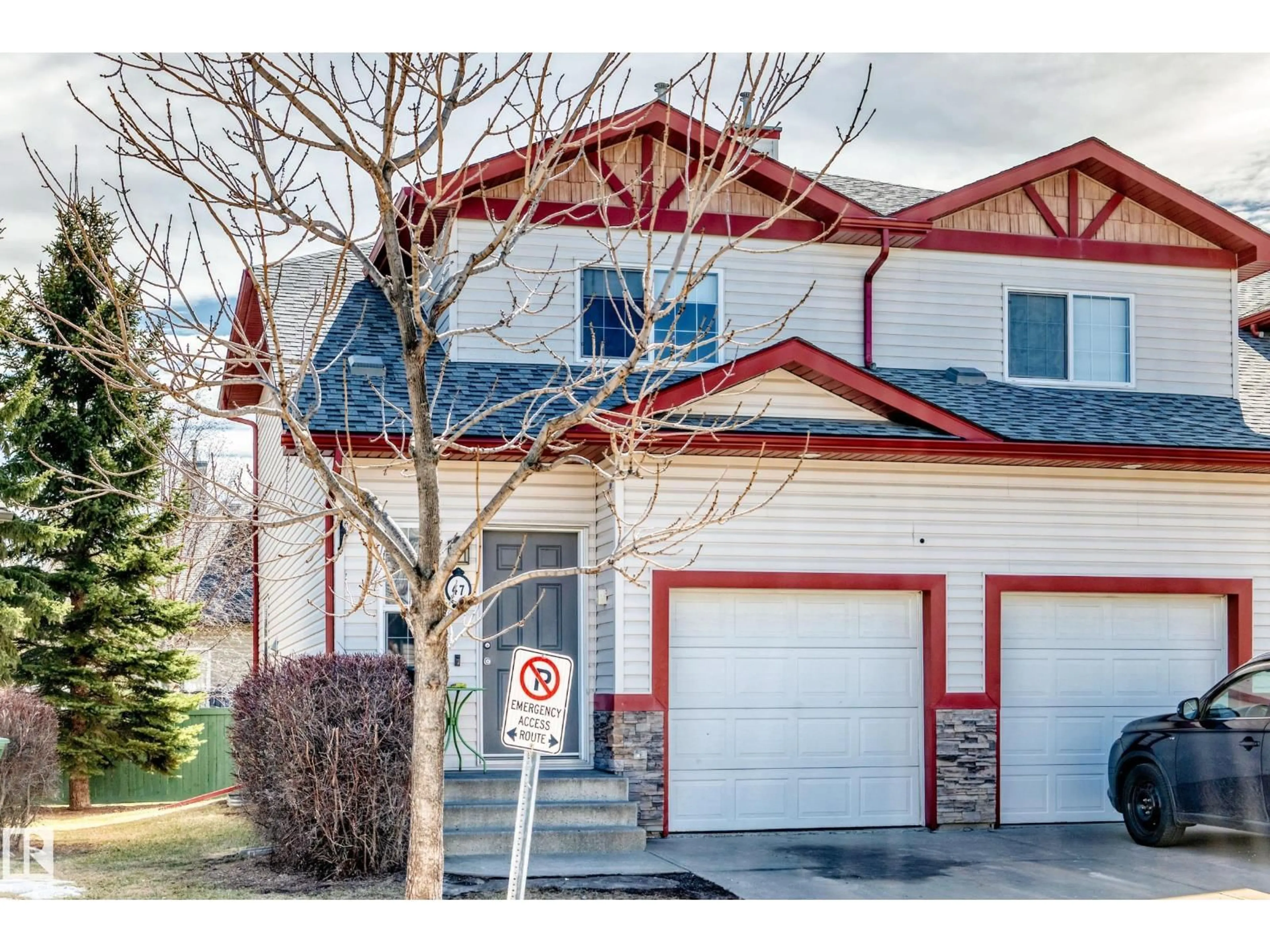 Home with vinyl exterior material, street for 15 - 47 WOODSMERE CL, Fort Saskatchewan Alberta T8L4S2