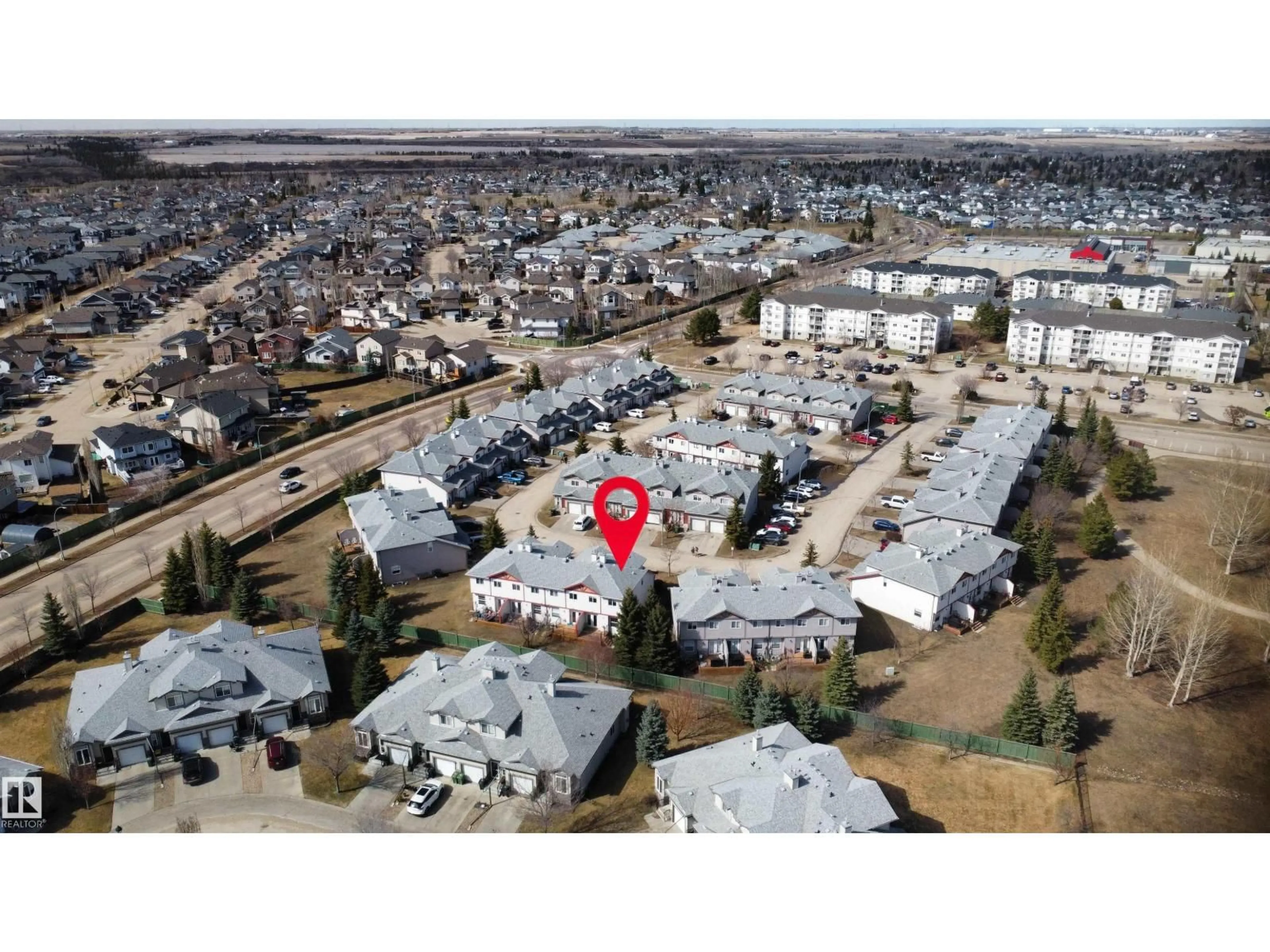 A pic from outside/outdoor area/front of a property/back of a property/a pic from drone, unknown for 15 - 47 WOODSMERE CL, Fort Saskatchewan Alberta T8L4S2