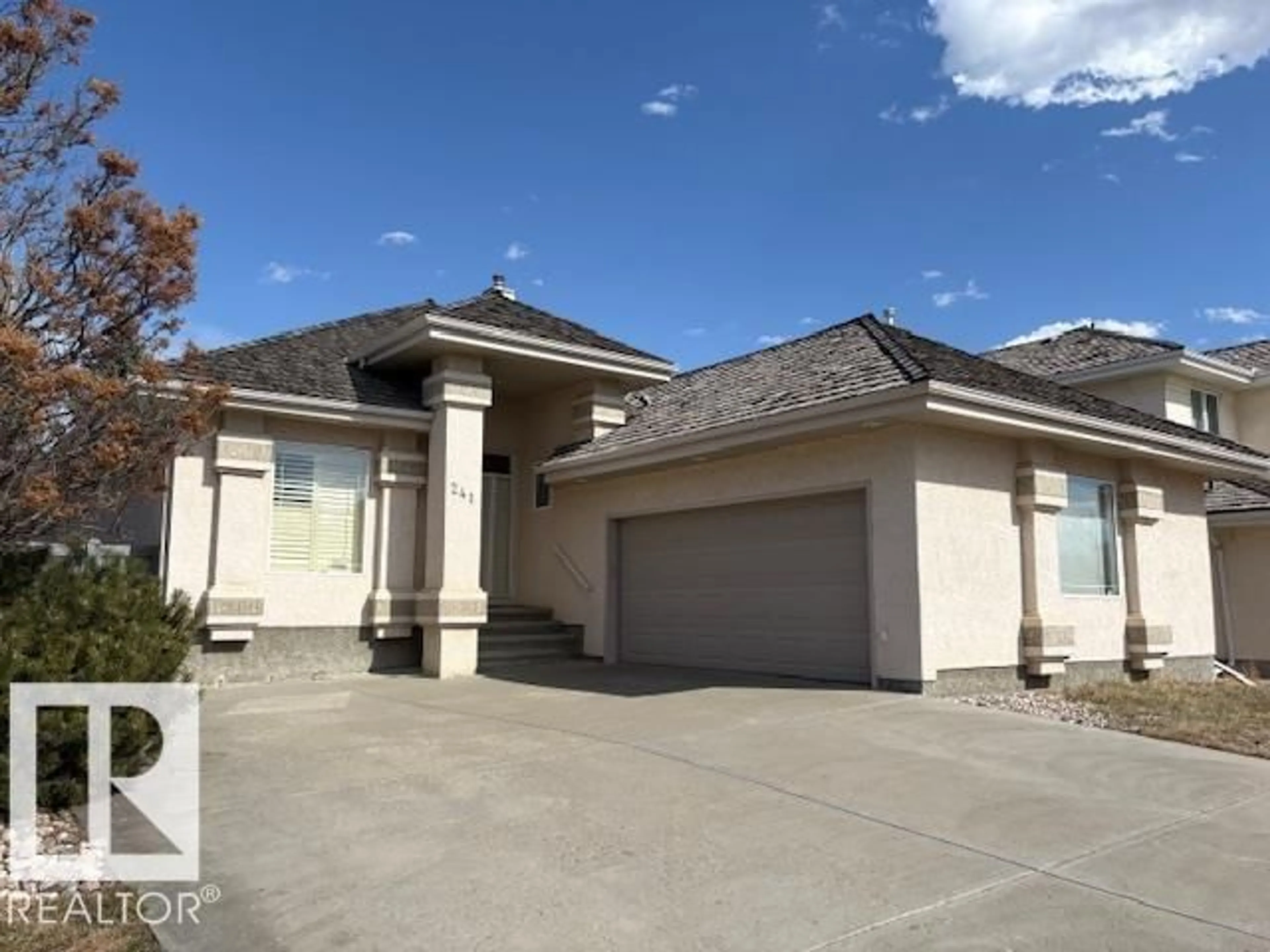 Home with vinyl exterior material, street for 241 DARLINGTON CR, Edmonton Alberta T6M2T1
