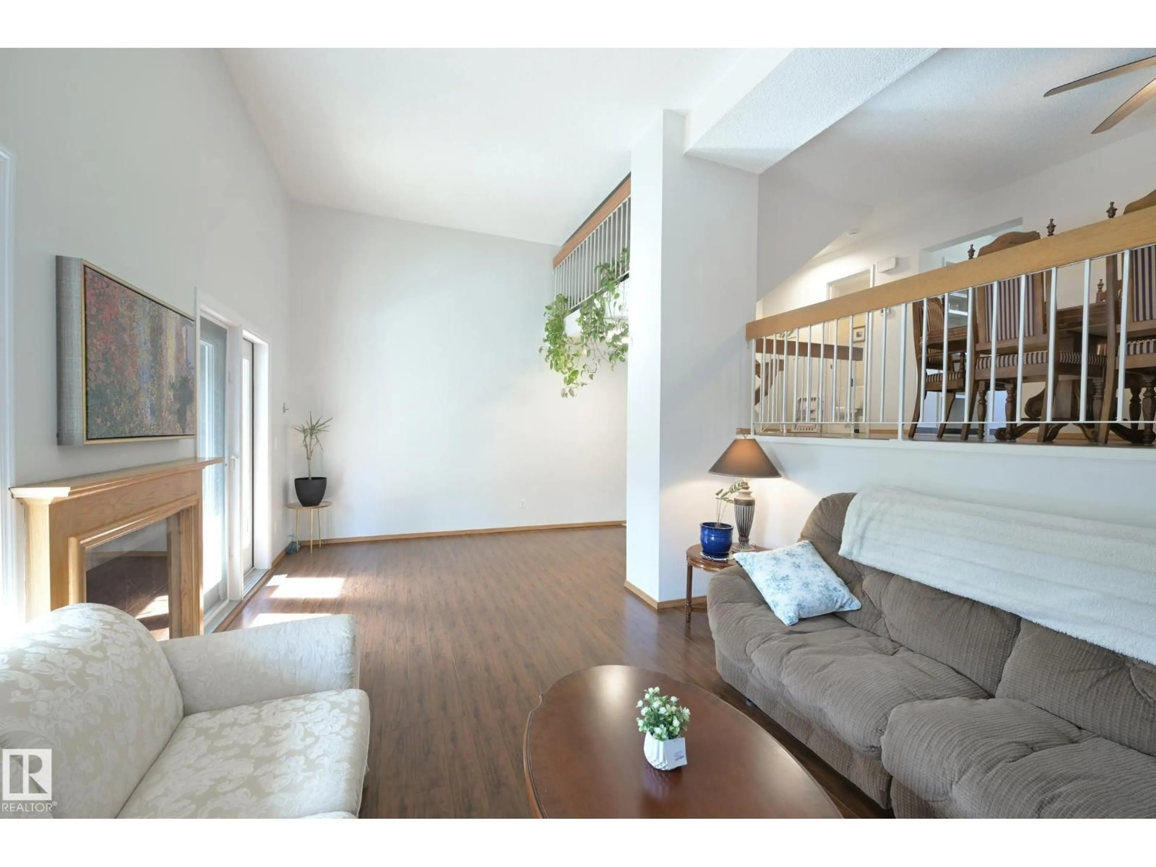 Living room with furniture, wood/laminate floor for 15 GLAEWYN ES, St. Albert Alberta T8N2P1