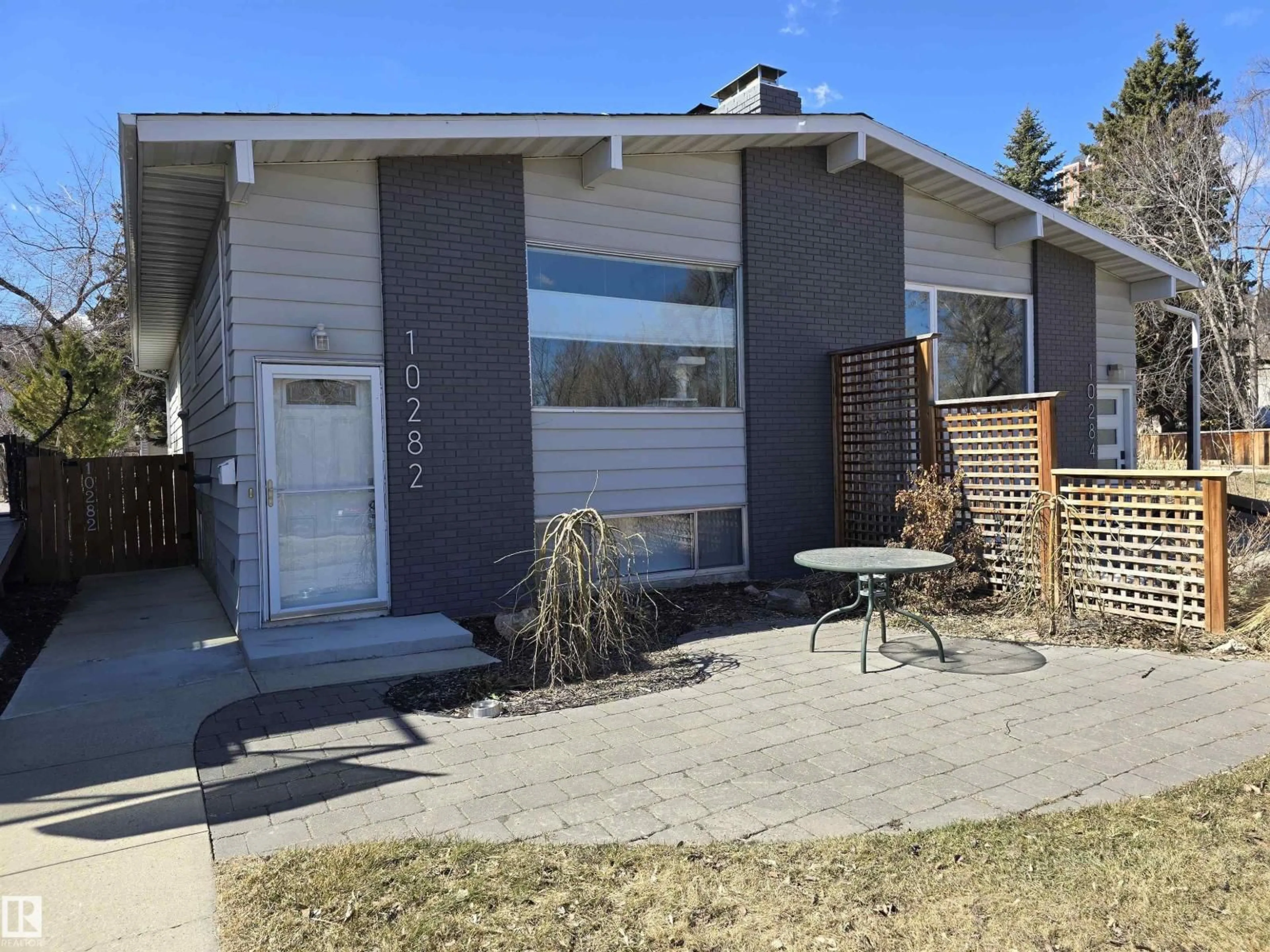 Home with vinyl exterior material, street for 10282 87 ST, Edmonton Alberta T5H1N6
