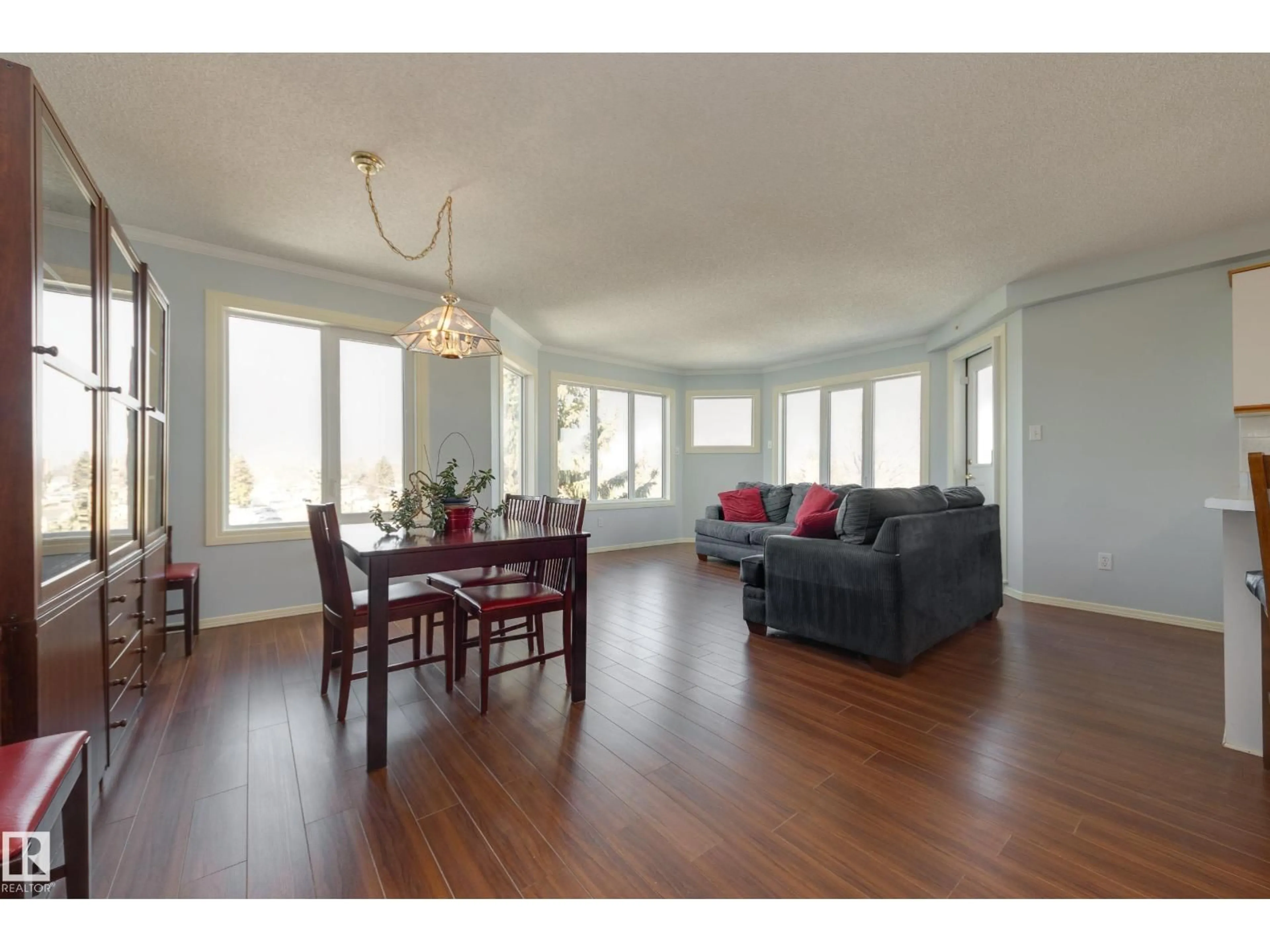 Living room with furniture, wood/laminate floor for #402 - 10610 76 ST, Edmonton Alberta T6A3Y9
