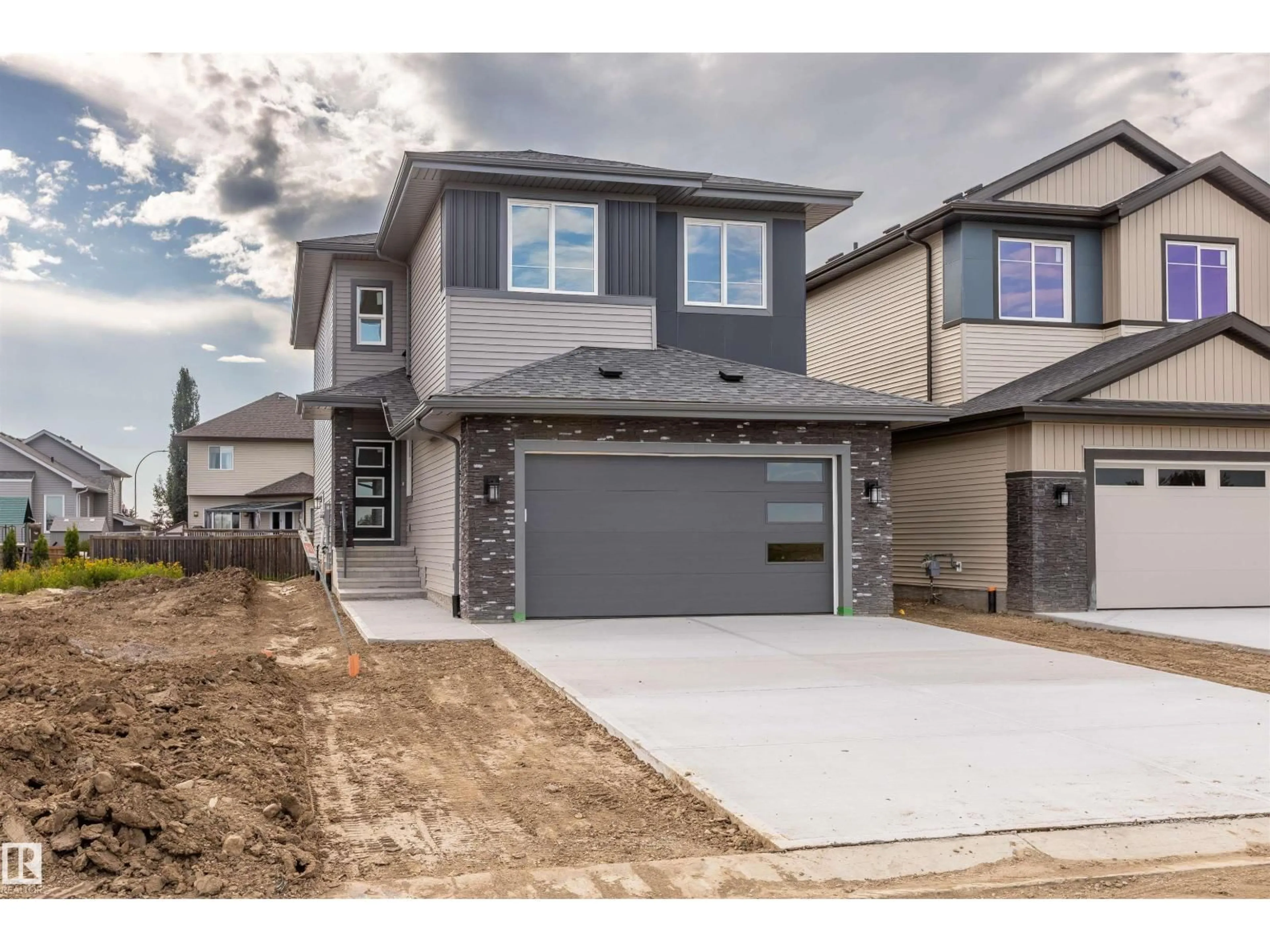 Home with brick exterior material, street for 10458 104 ST, Morinville Alberta T8R0C9