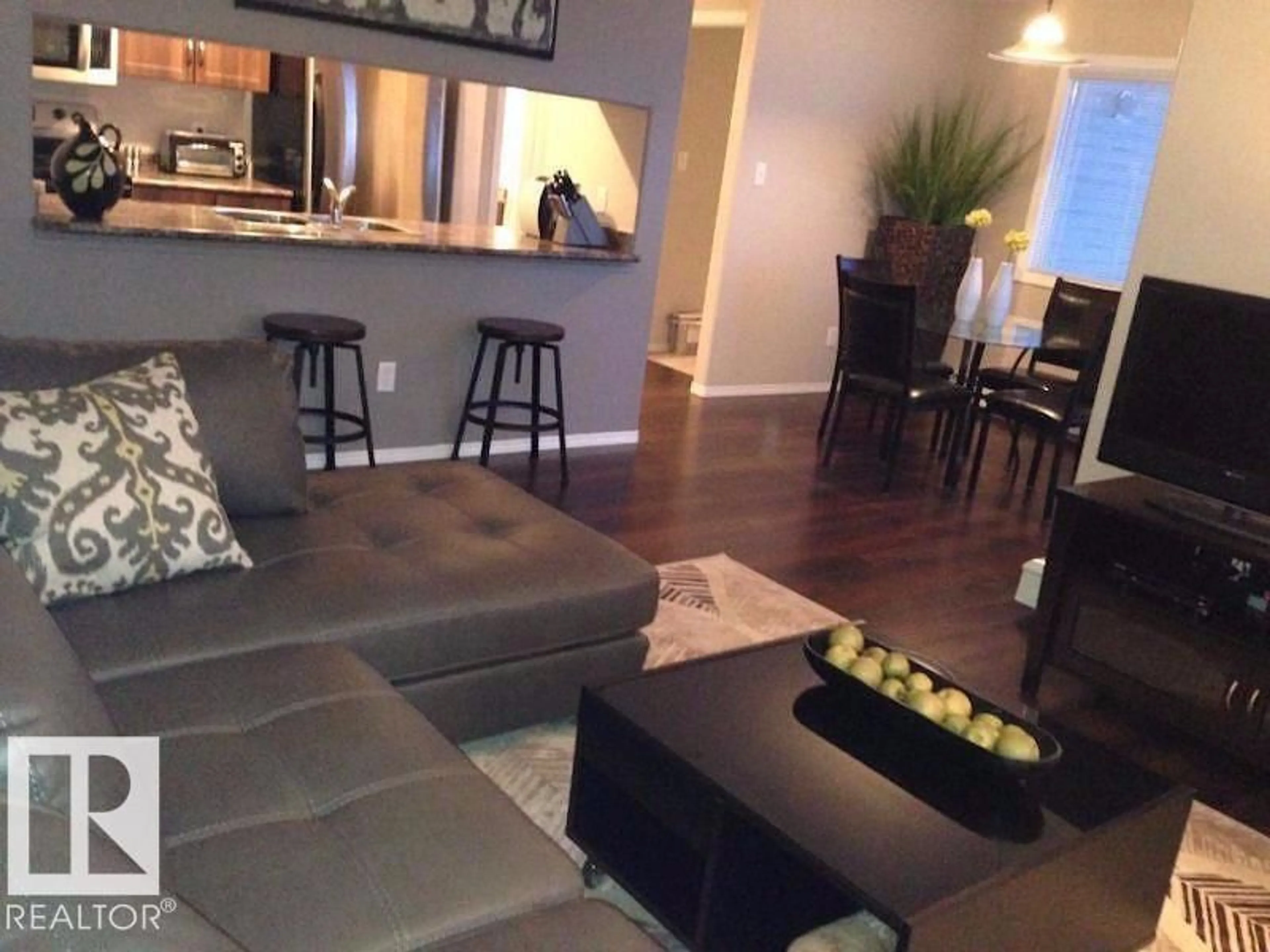 Living room with furniture, wood/laminate floor for 345 WOODSMERE CL, Fort Saskatchewan Alberta T8L4N9