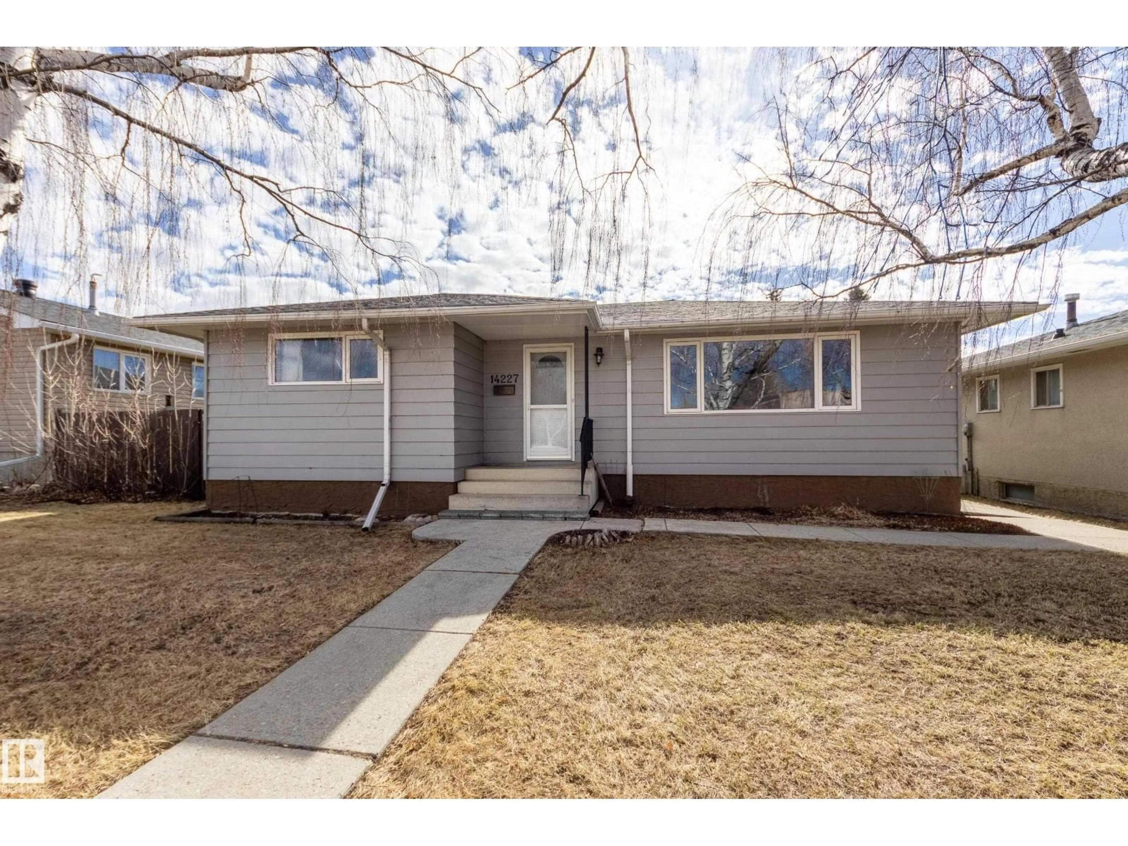Home with vinyl exterior material, street for NW - 14227 74 ST, Edmonton Alberta T5C0Y1