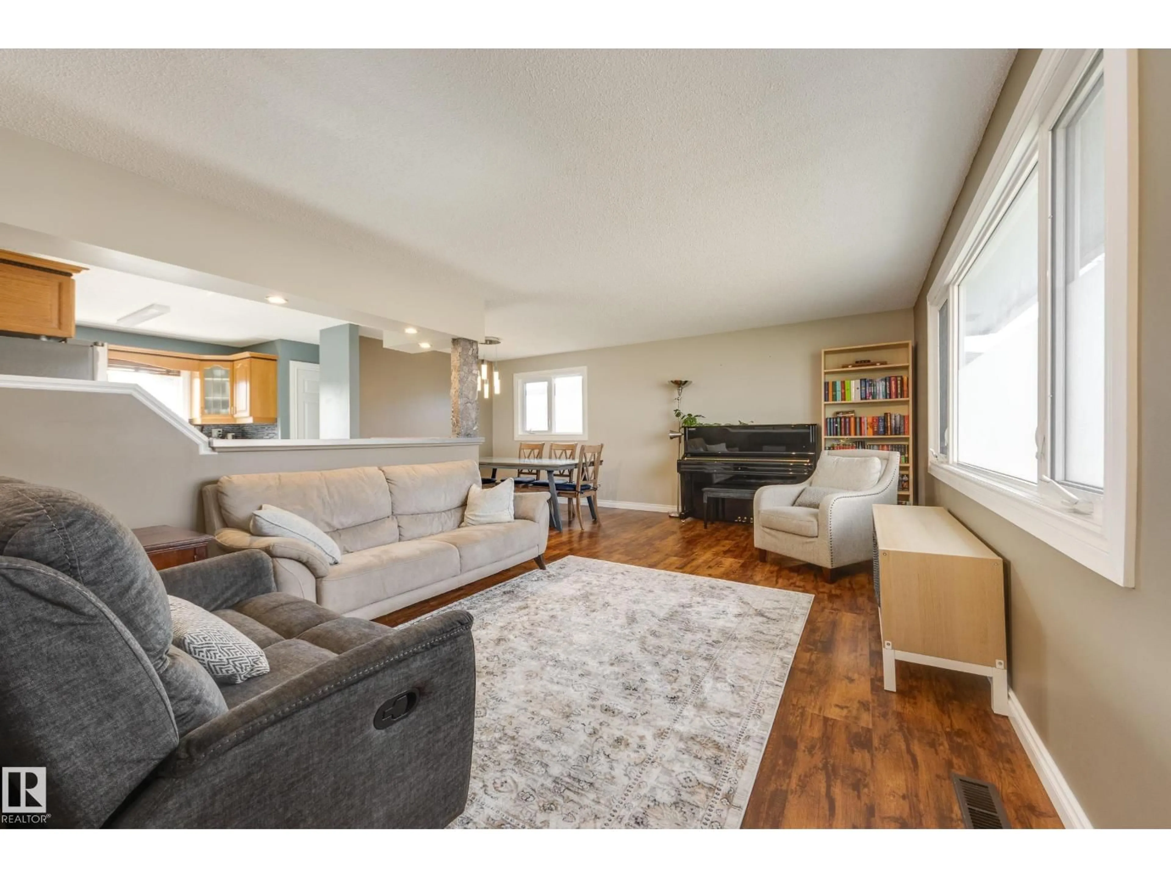 Living room with furniture, wood/laminate floor for NW - 14227 74 ST, Edmonton Alberta T5C0Y1