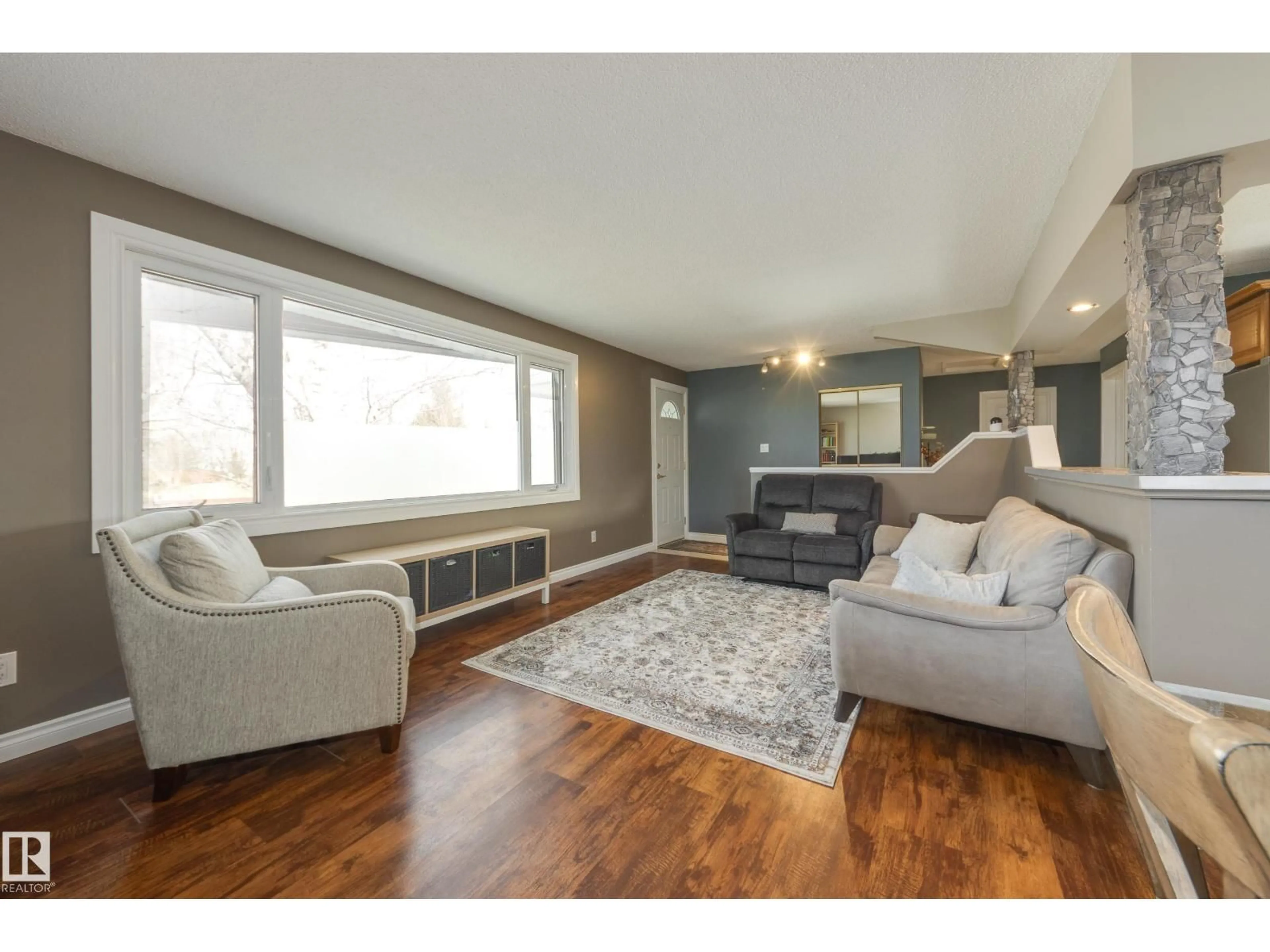 Living room with furniture, wood/laminate floor for NW - 14227 74 ST, Edmonton Alberta T5C0Y1
