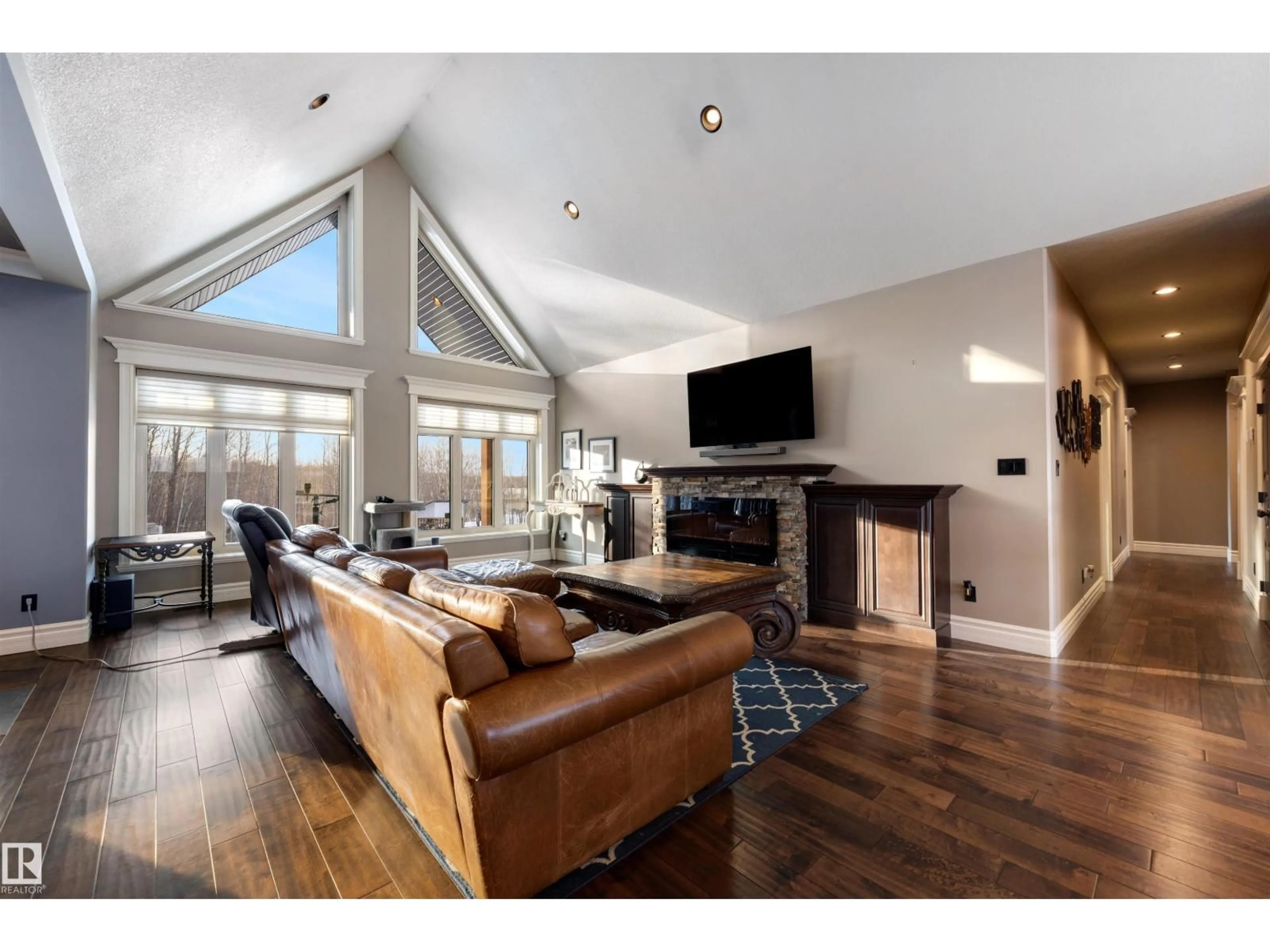 Living room with furniture, wood/laminate floor for 14170 TOWNSHIP ROAD 672 A, Rural Lac La Biche County Alberta T0A2C0