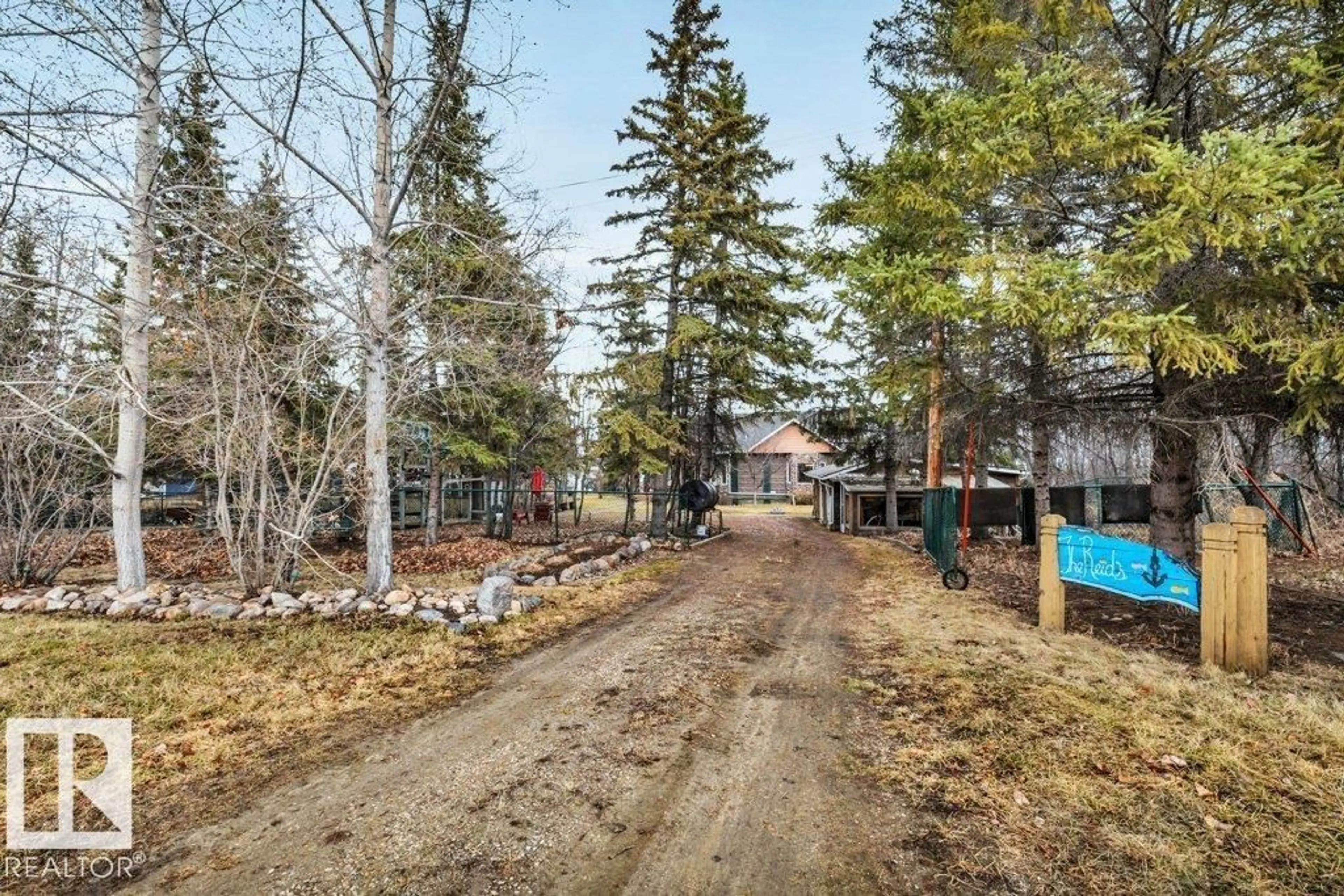 A pic from outside/outdoor area/front of a property/back of a property/a pic from drone, forest/trees view for 13 - 52427 RGE RD 50, Rural Parkland County Alberta T0E2B0