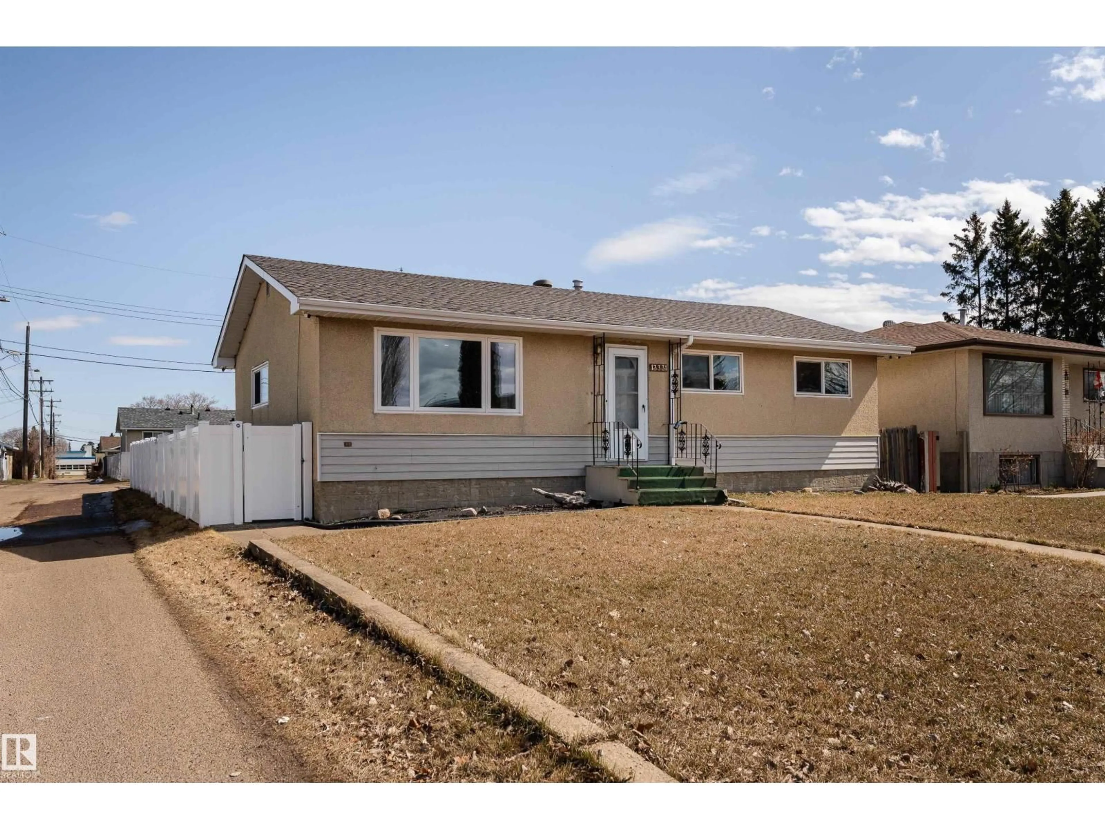 Home with vinyl exterior material, street for NW - 13331 64 ST, Edmonton Alberta T5A0Y6
