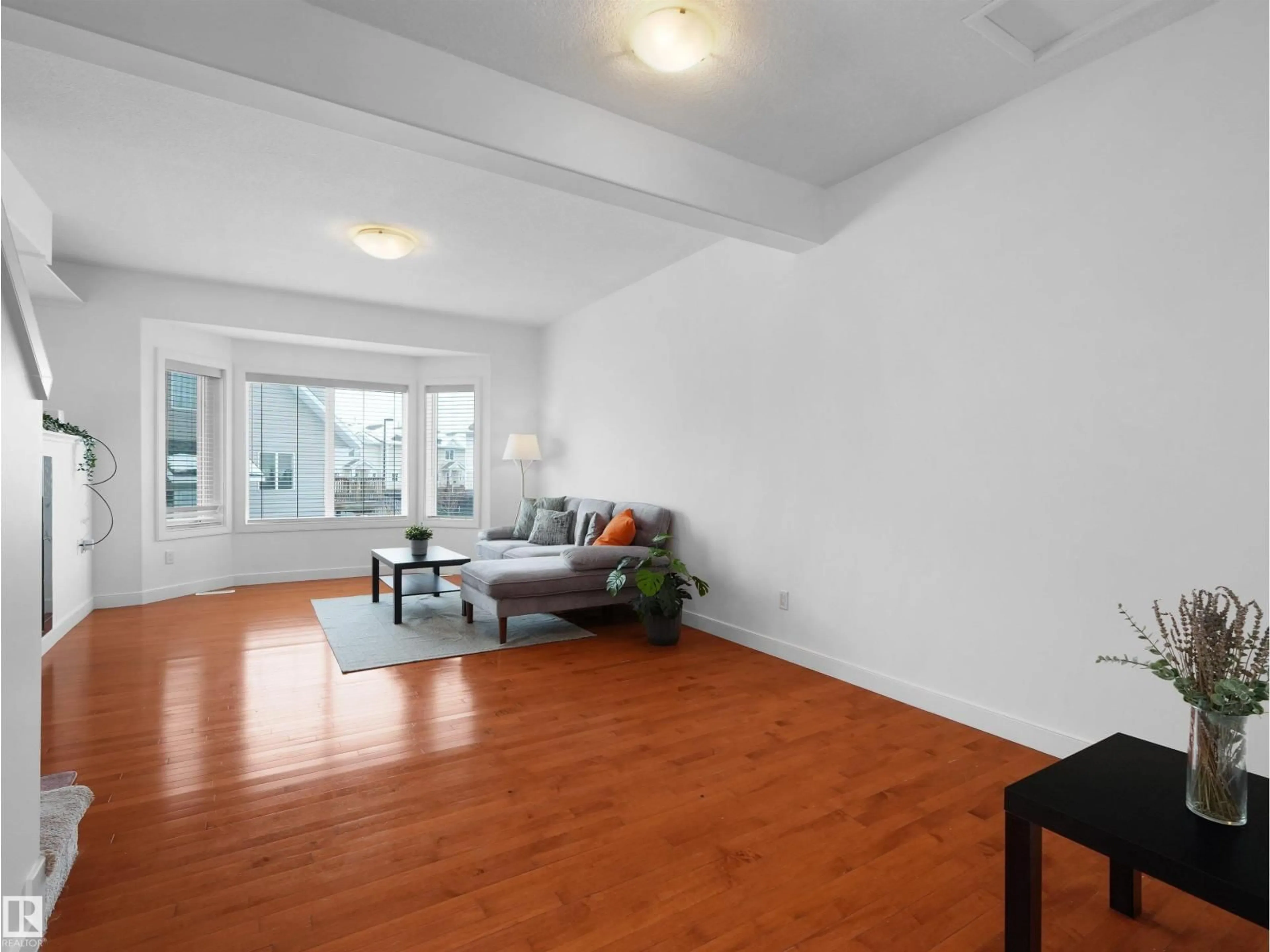 Living room with furniture, wood/laminate floor for #11 - 13215 153 AV, Edmonton Alberta T6V0B6