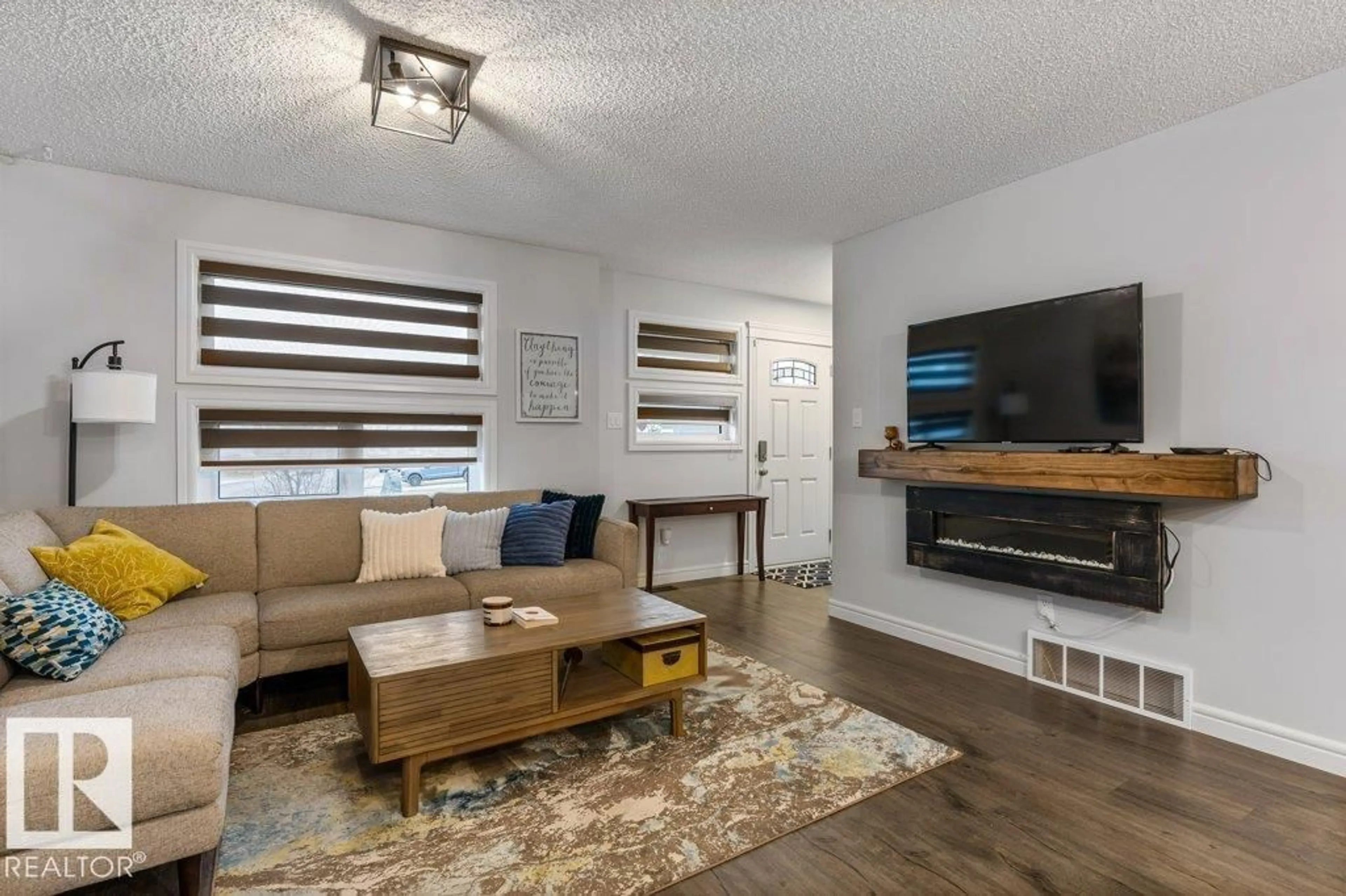 Living room with furniture, wood/laminate floor for 1271 SANDSTONE BV, Sherwood Park Alberta T8H1B2