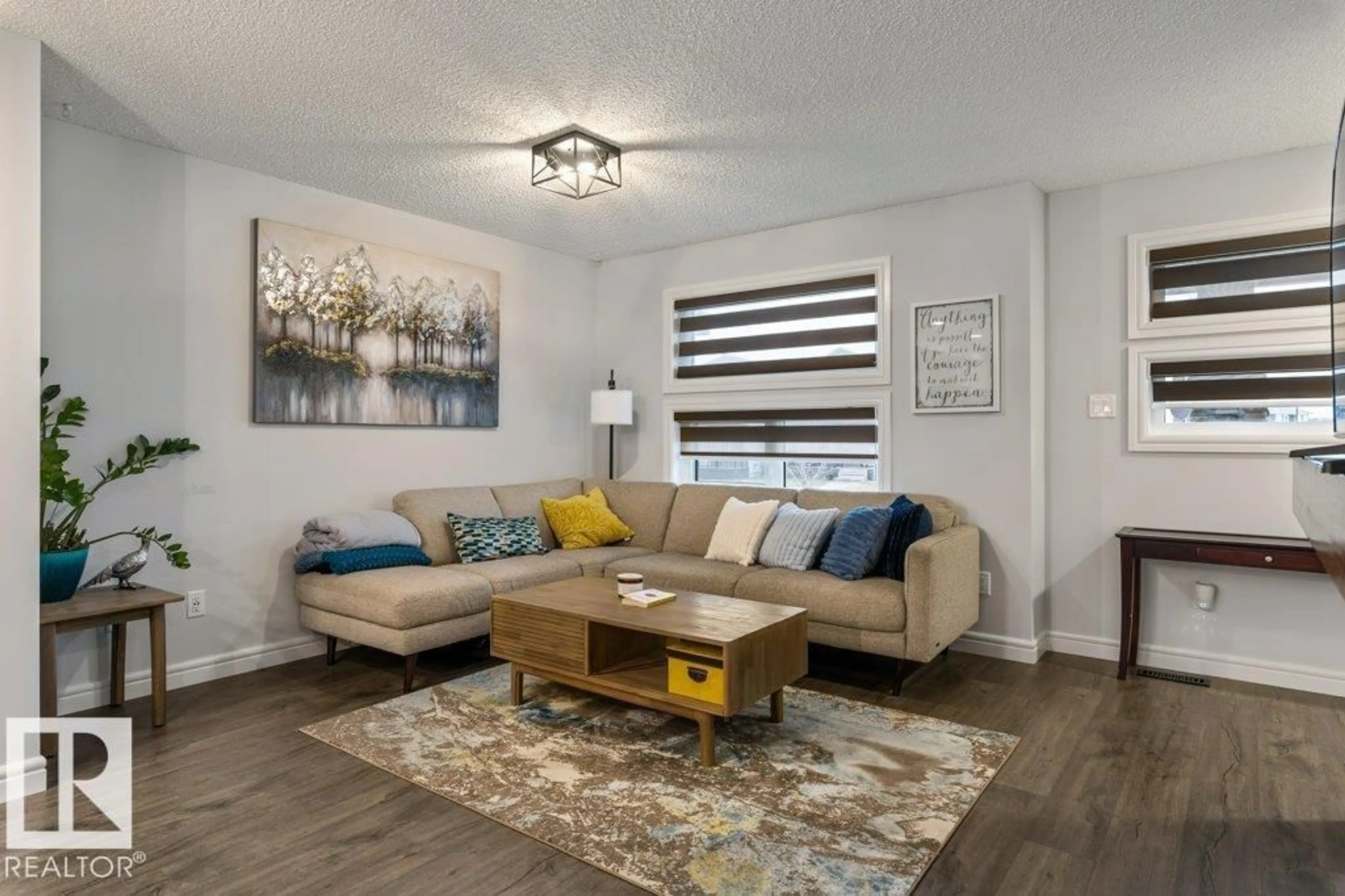 Living room with furniture, wood/laminate floor for 1271 SANDSTONE BV, Sherwood Park Alberta T8H1B2