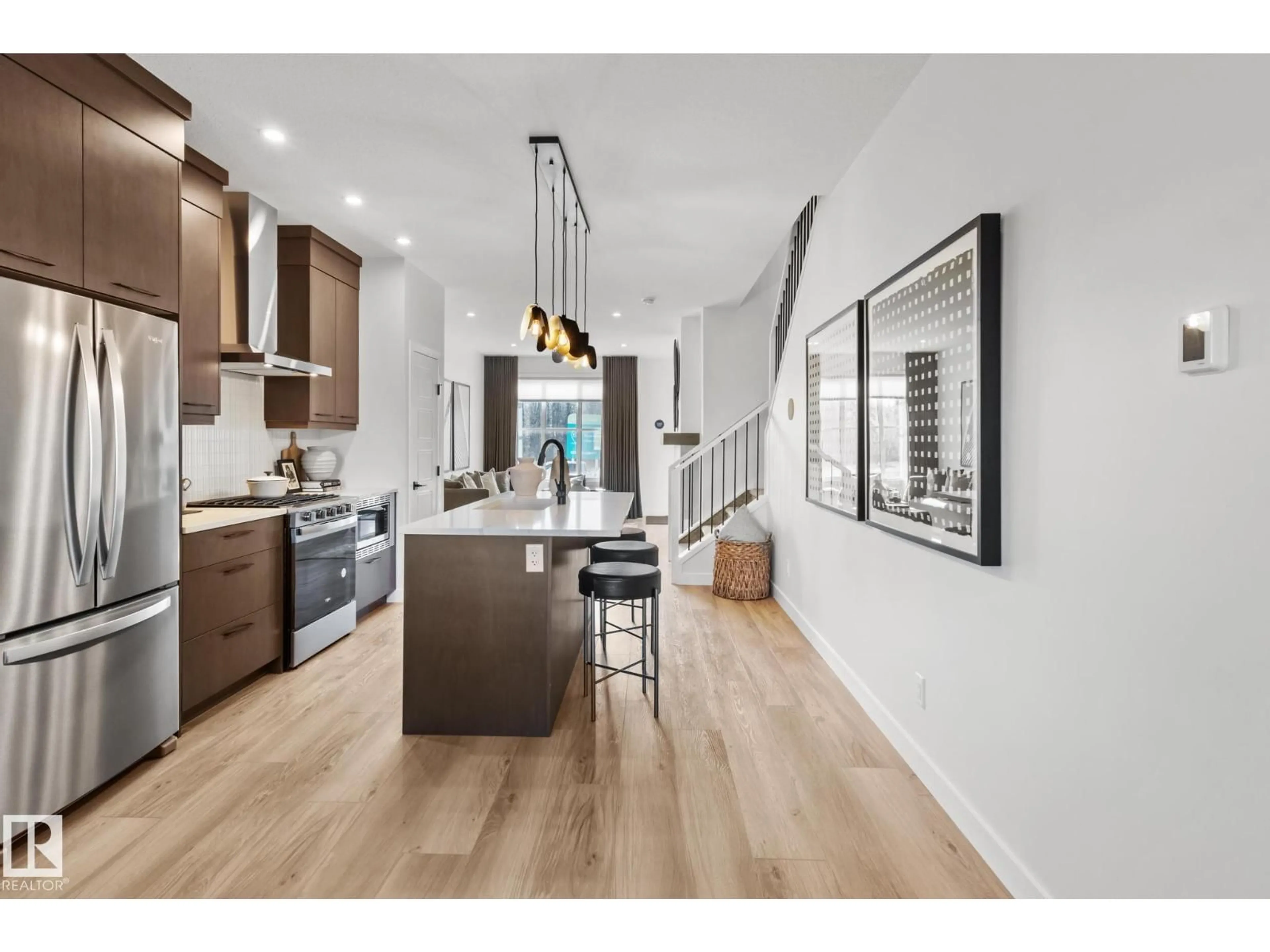 Open concept kitchen, wood/laminate floor for SW - 12532 35 AV, Edmonton Alberta T6W1R6