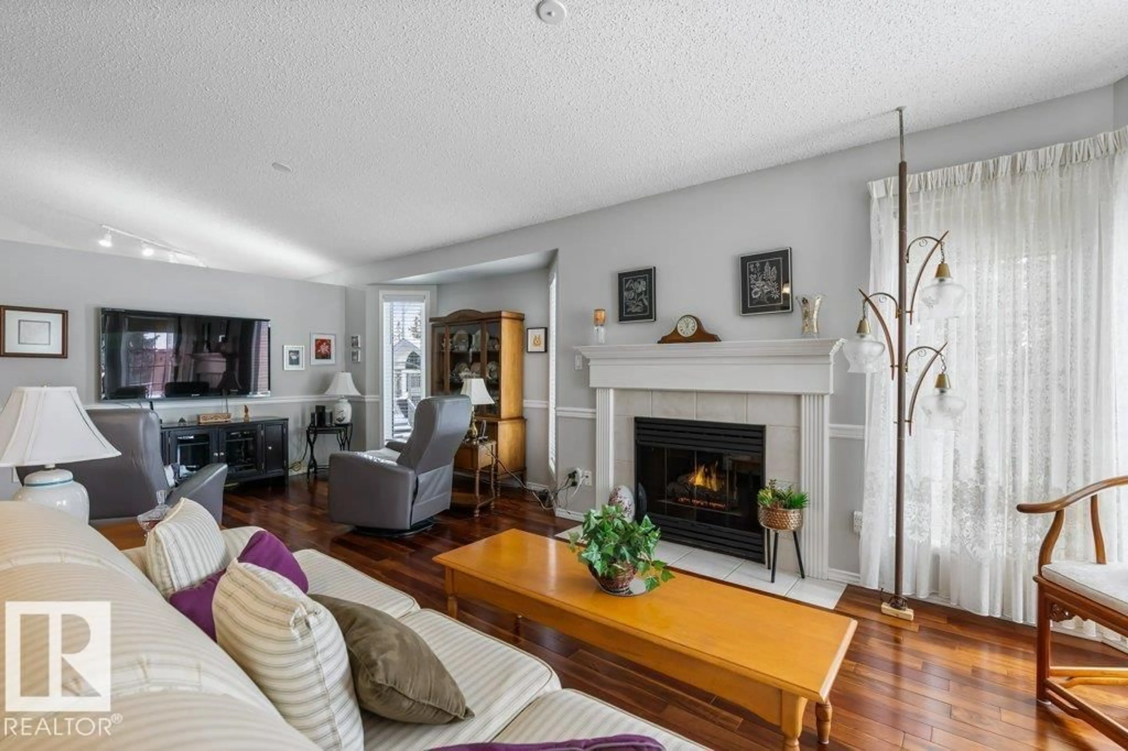 Living room with furniture, wood/laminate floor for 19 GERVAIS RD, St. Albert Alberta T8N6N1