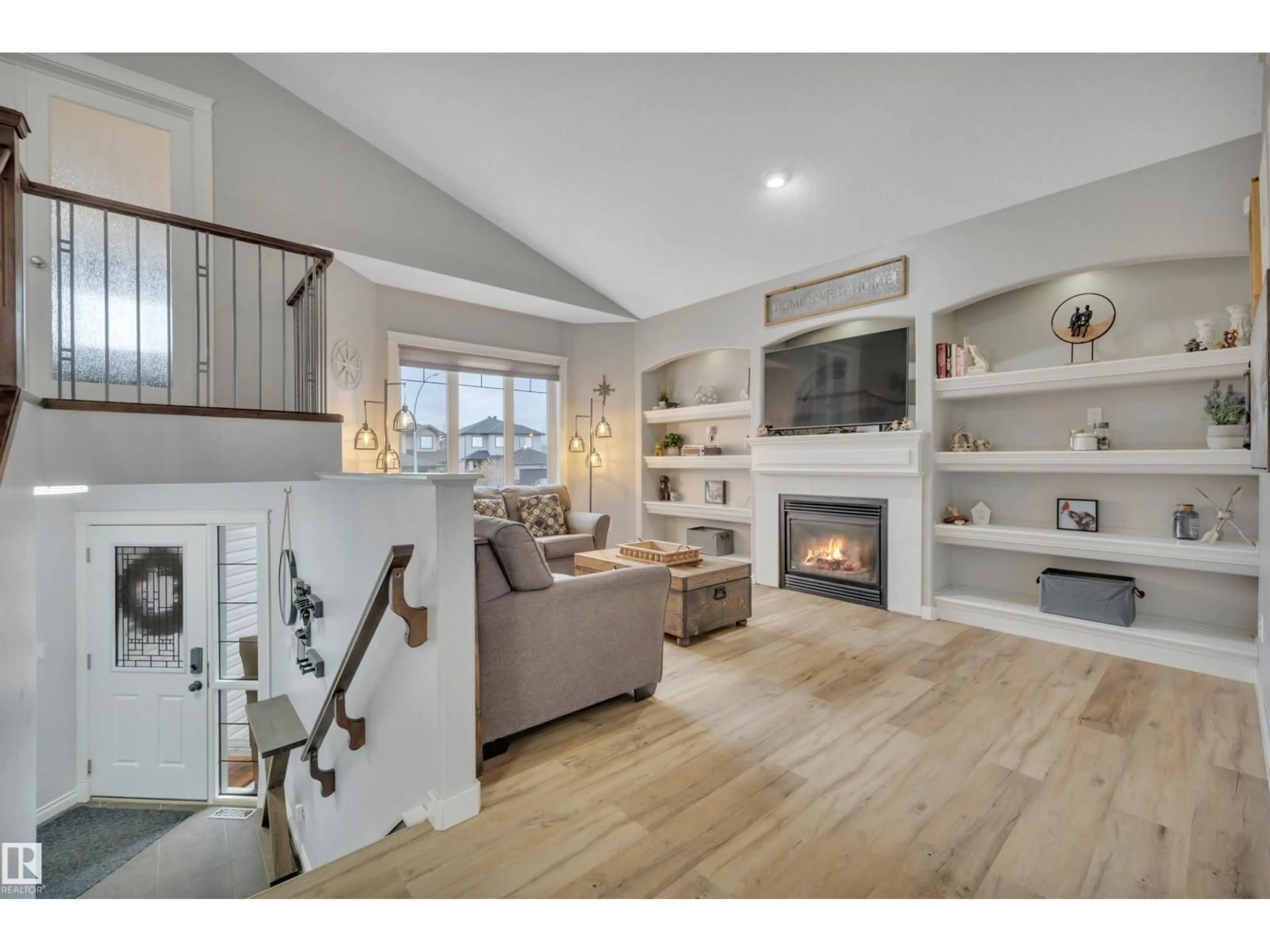 Living room with furniture, wood/laminate floor for 8406 96 ST, Morinville Alberta T8R0A6