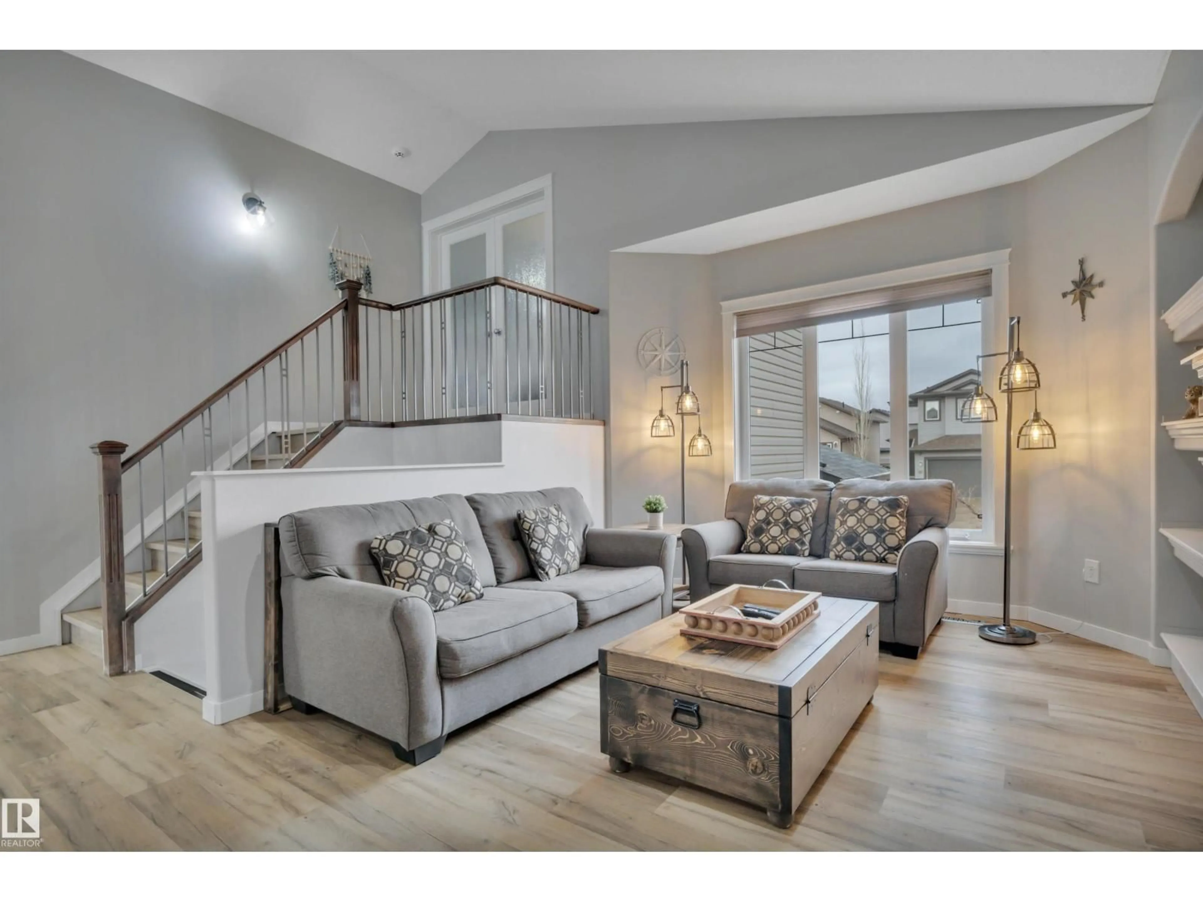 Living room with furniture, wood/laminate floor for 8406 96 ST, Morinville Alberta T8R0A6