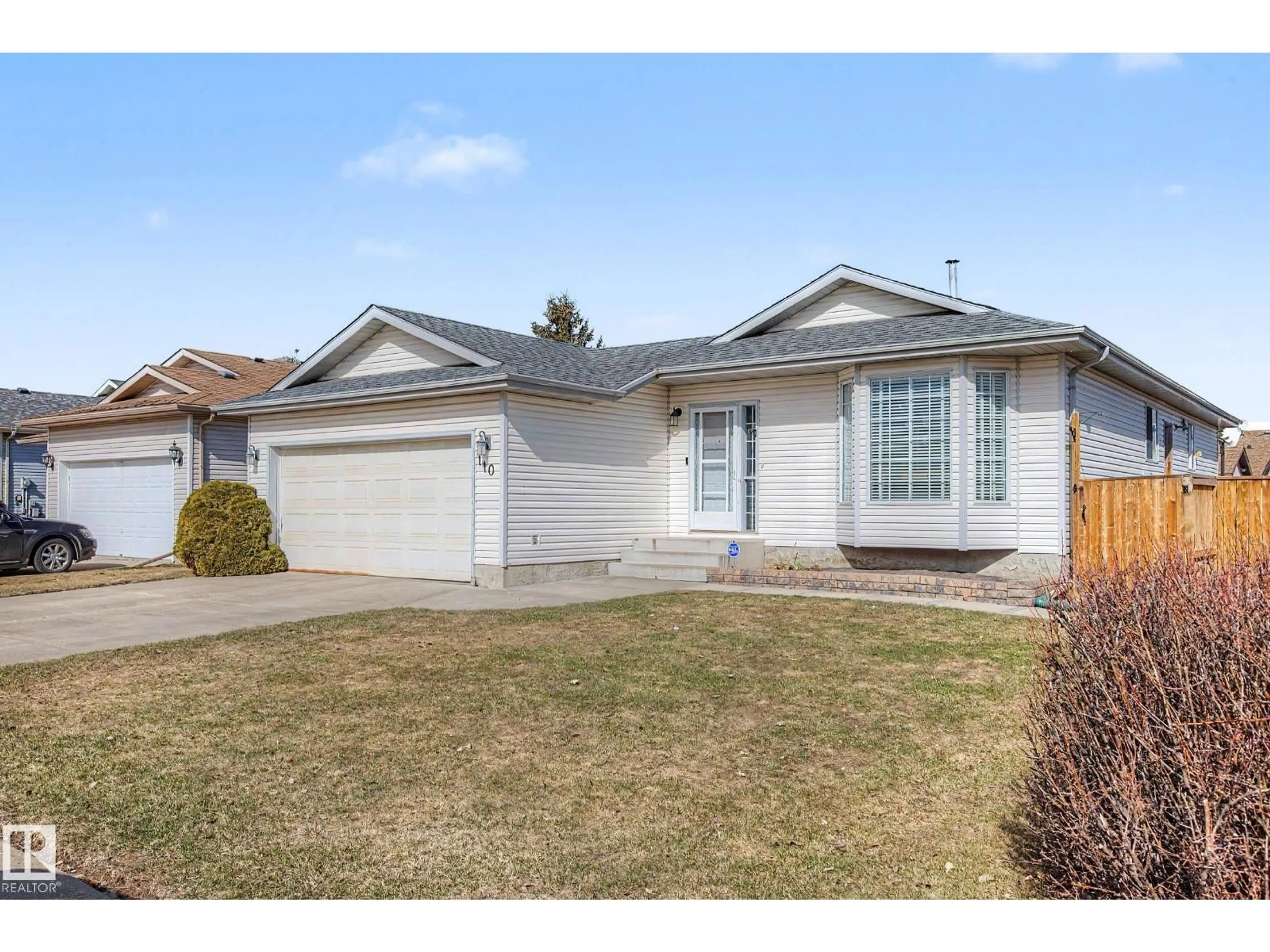 Home with vinyl exterior material, street for 110 LUNNON DR, Gibbons Alberta T0A1N0