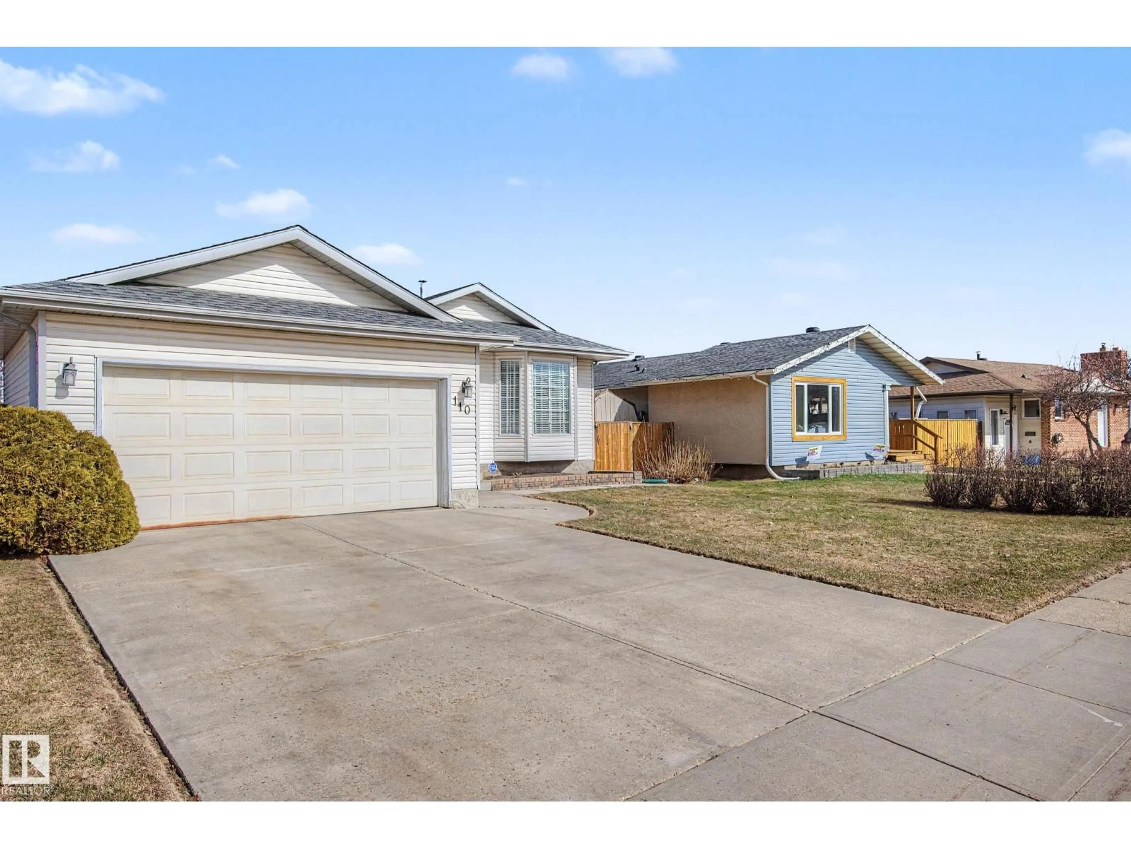 Home with vinyl exterior material, street for 110 LUNNON DR, Gibbons Alberta T0A1N0