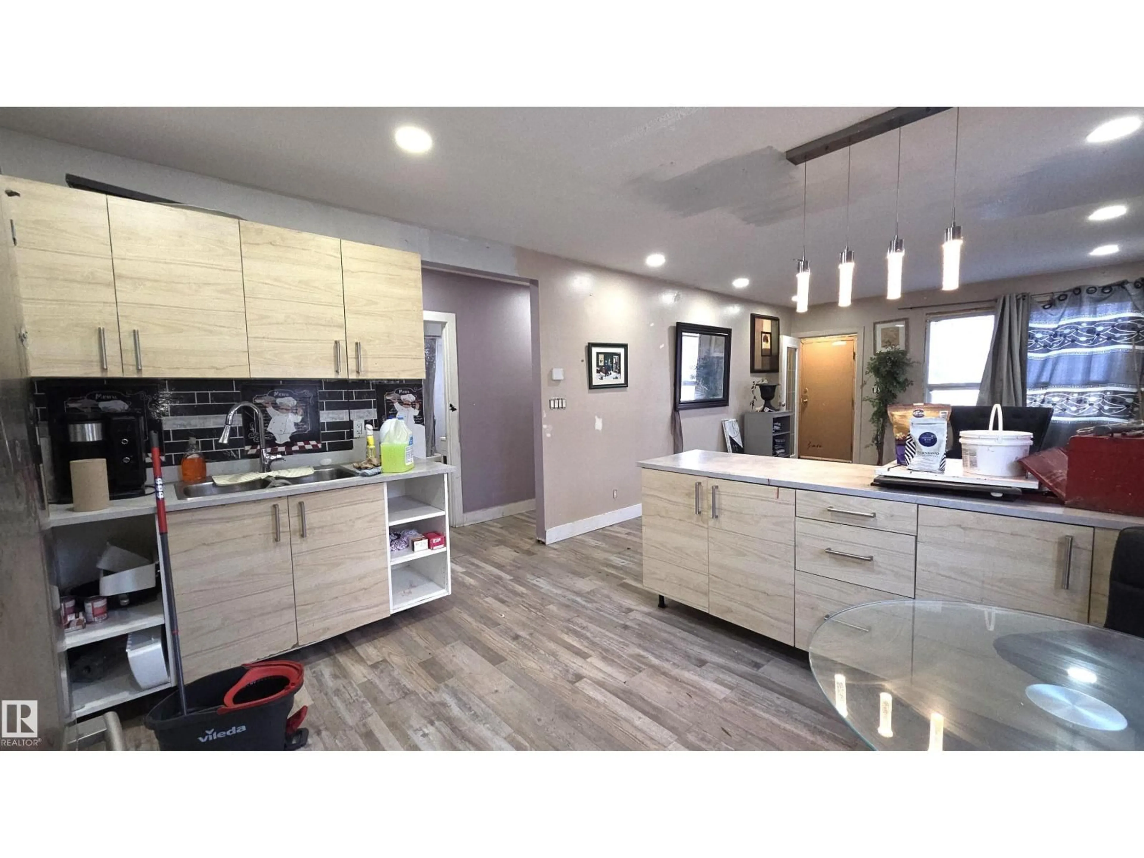 Open concept kitchen, wood/laminate floor for NW - 10644 96 ST, Edmonton Alberta T5J2J3