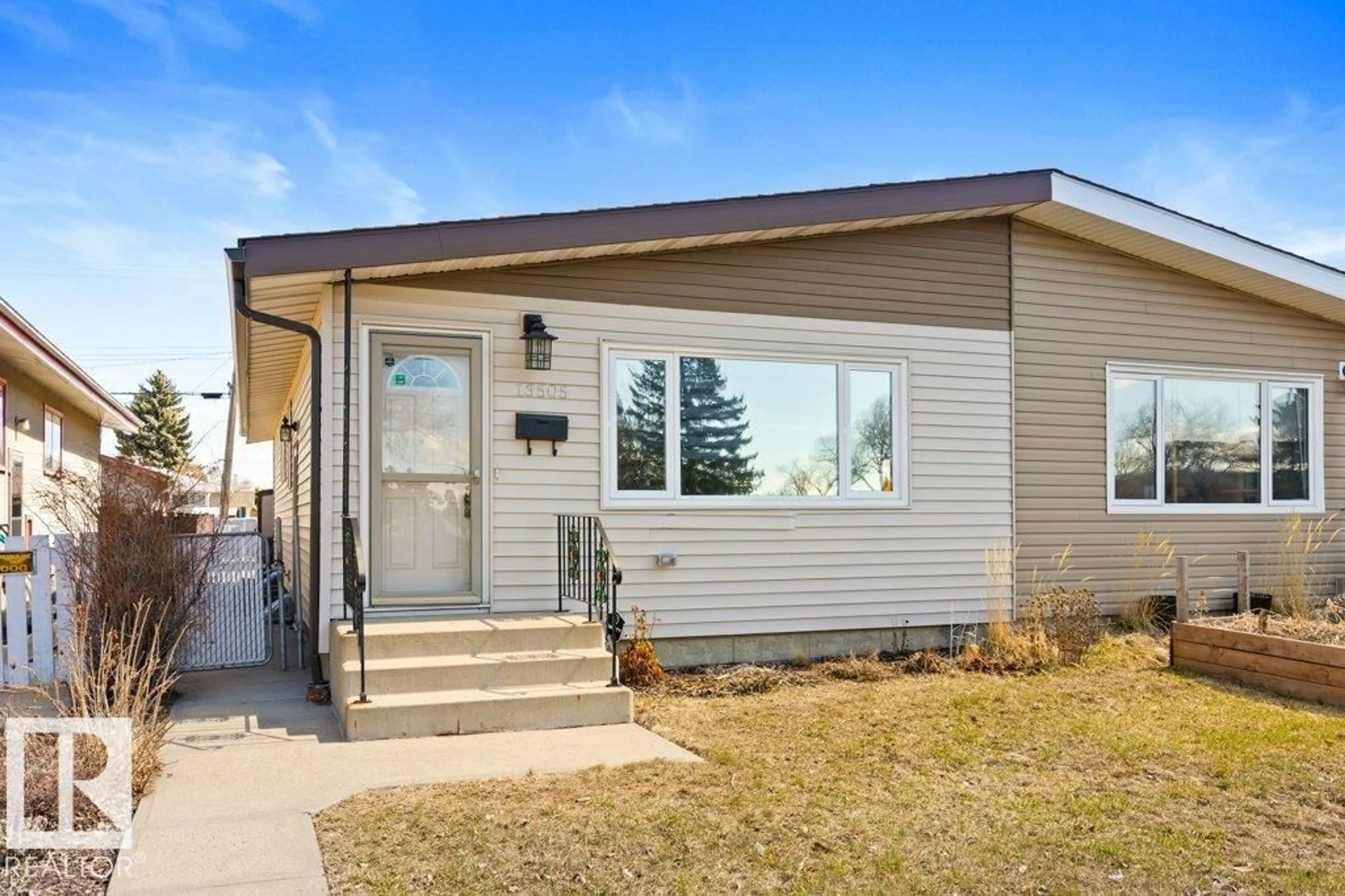 Home with vinyl exterior material, street for 13505 119 ST, Edmonton Alberta T5E5M9