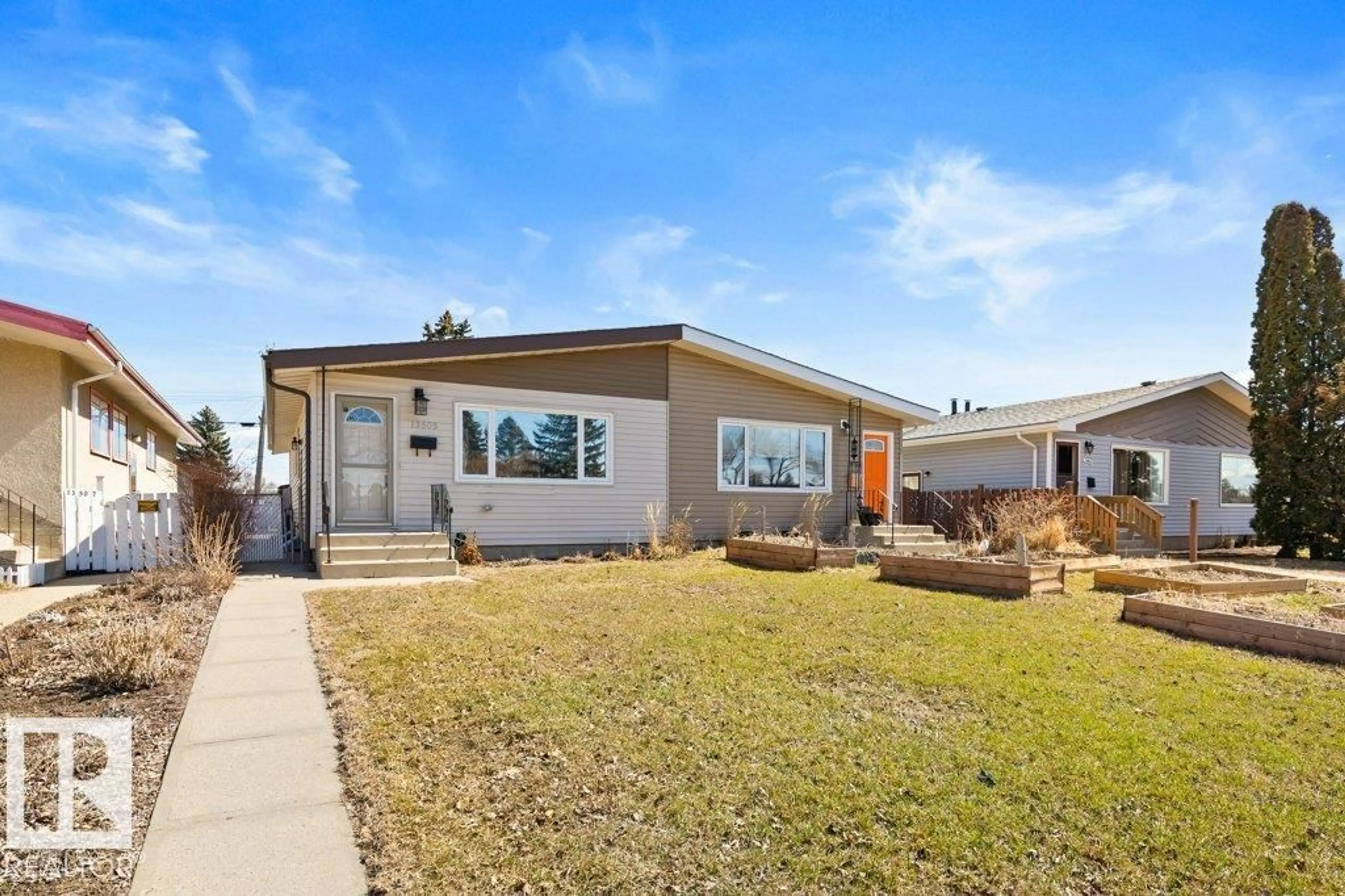 Home with vinyl exterior material, street for 13505 119 ST, Edmonton Alberta T5E5M9