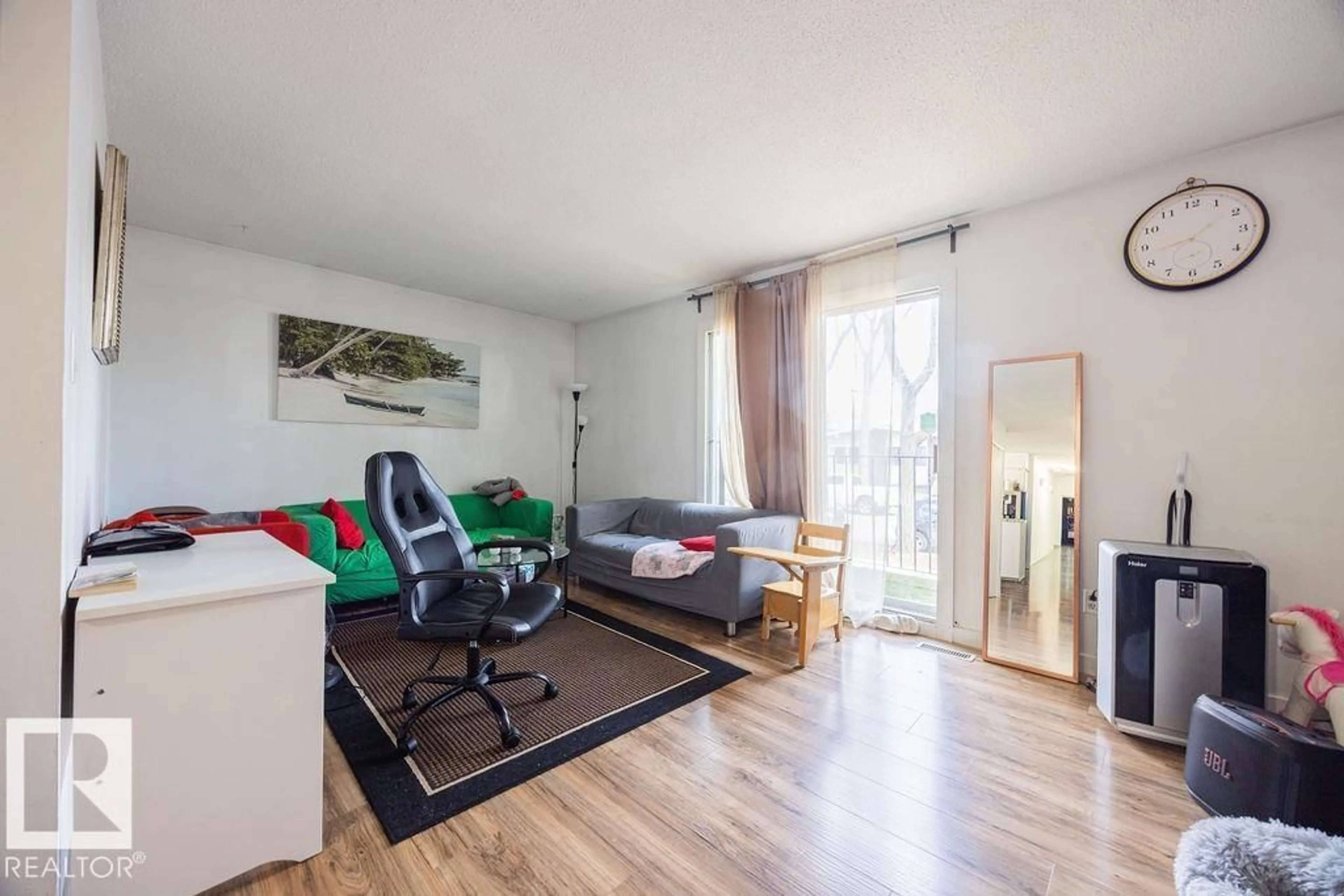 Living room with furniture, wood/laminate floor for 12824 123 ST, Edmonton Alberta T5L0J3