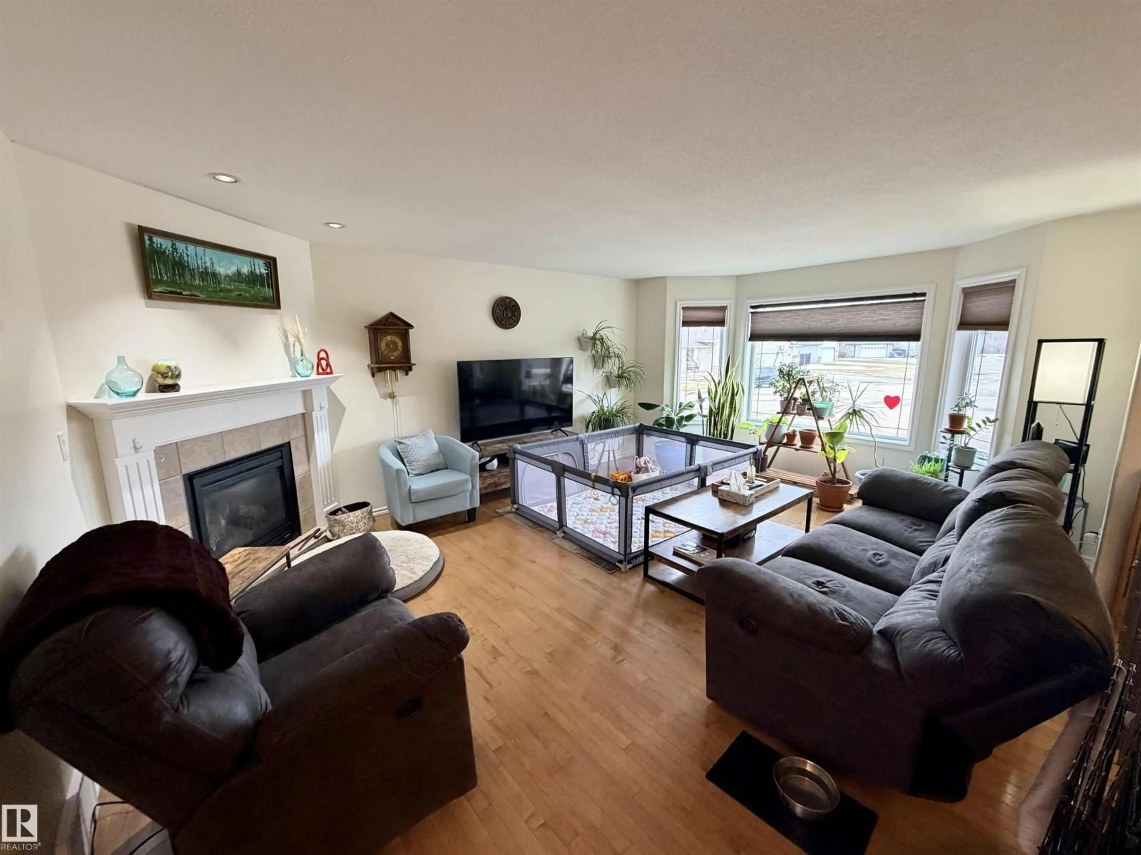 Living room with furniture, wood/laminate floor for 5614 48 AV, St. Paul Town Alberta T0A3A1