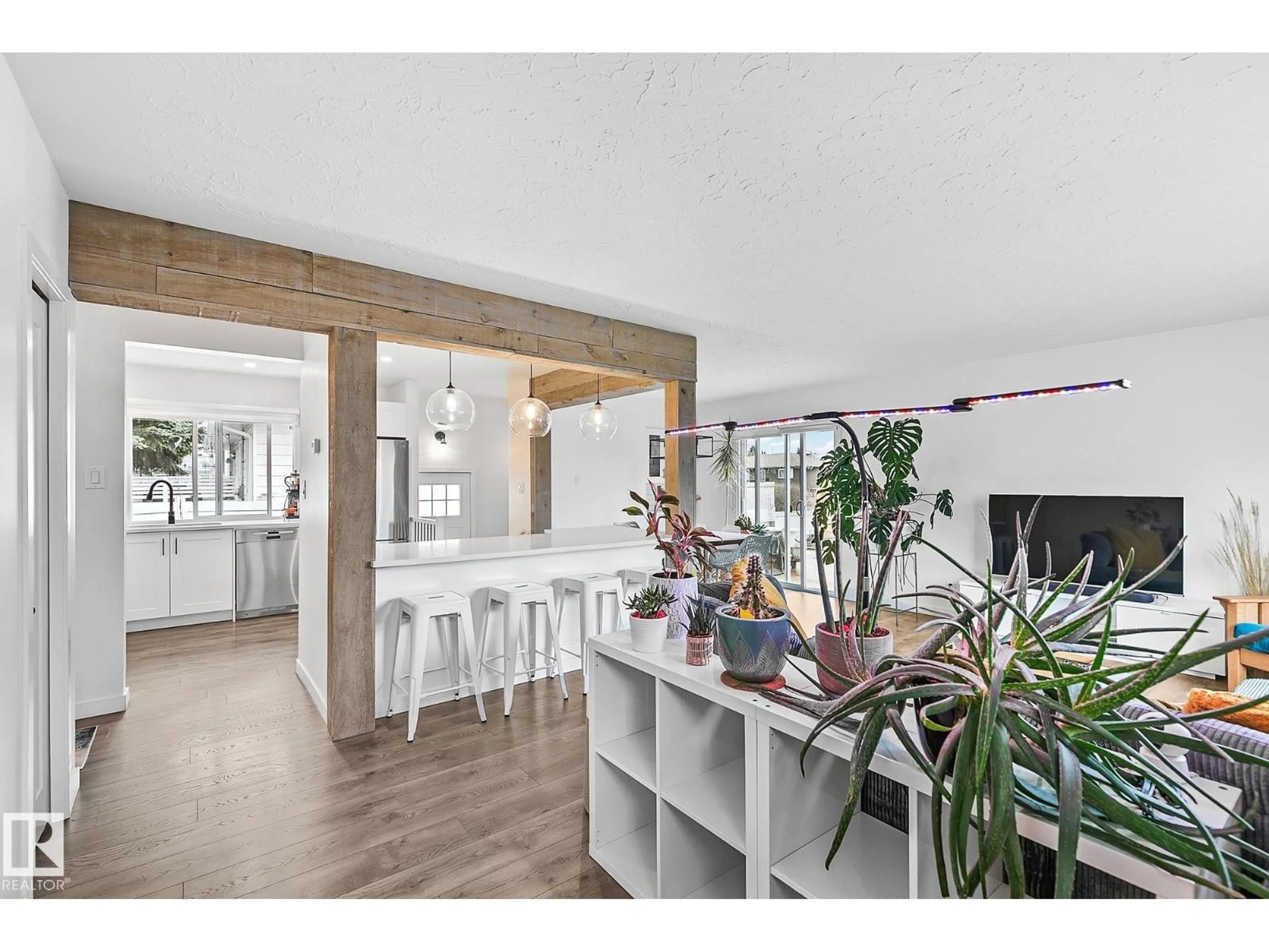 Open concept kitchen, wood/laminate floor for 10315 47 ST, Edmonton Alberta T6A1Z6