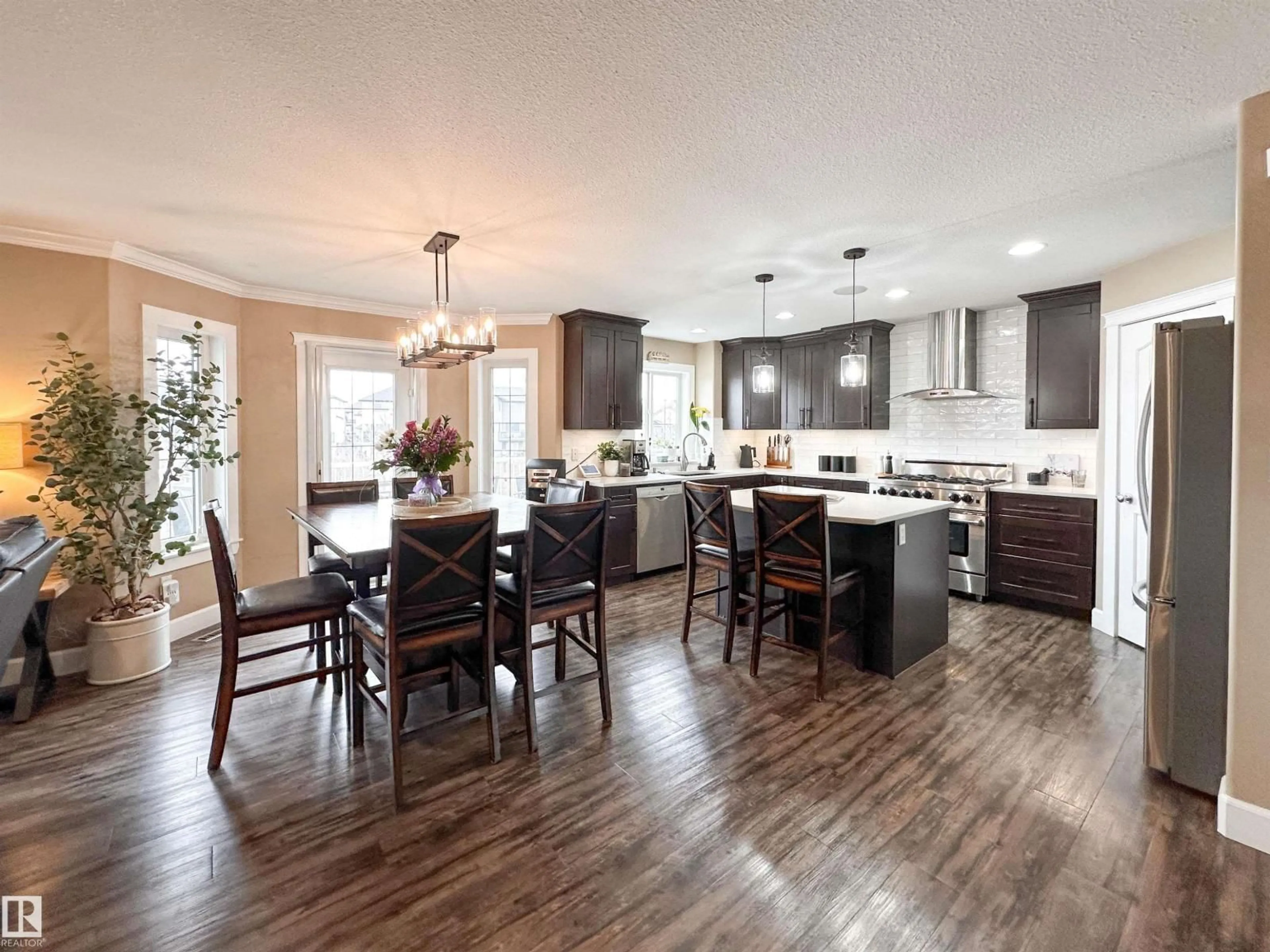 Open concept kitchen, wood/laminate floor for NW - 13715 149 AV, Edmonton Alberta T6V1R2