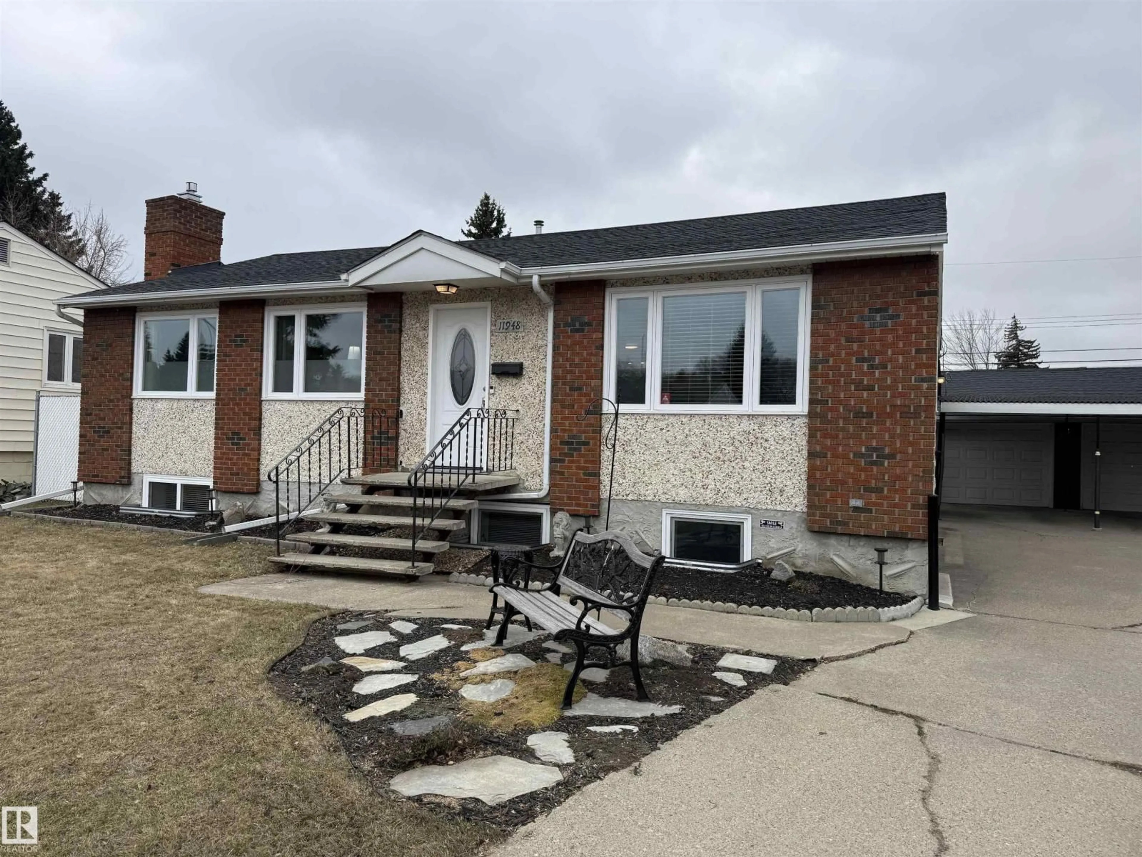 Home with vinyl exterior material, street for NW - 11948 132 ST, Edmonton Alberta T5L1P4