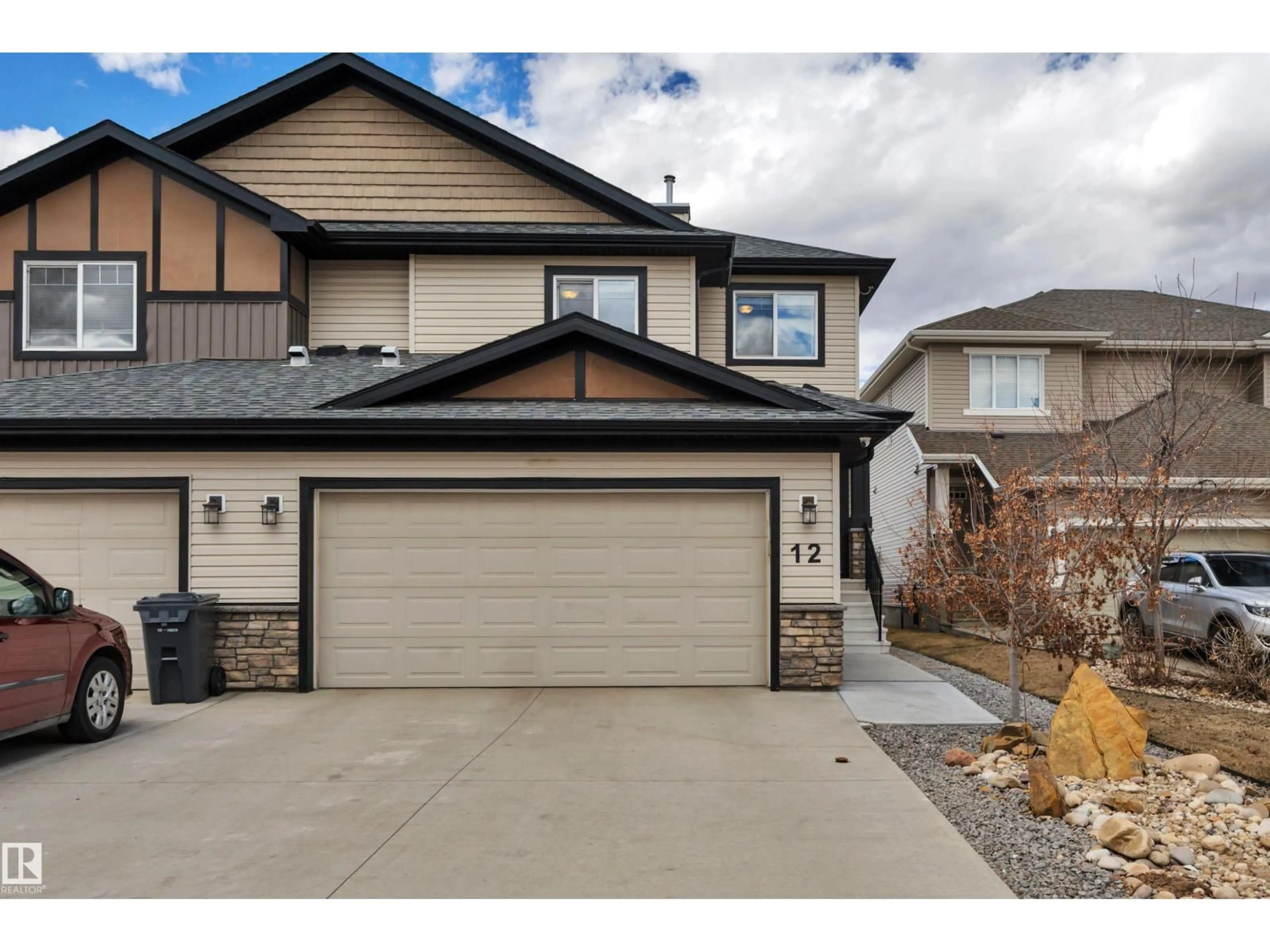 Home with vinyl exterior material, street for 12 MCLEAN, Leduc Alberta T9E1A3