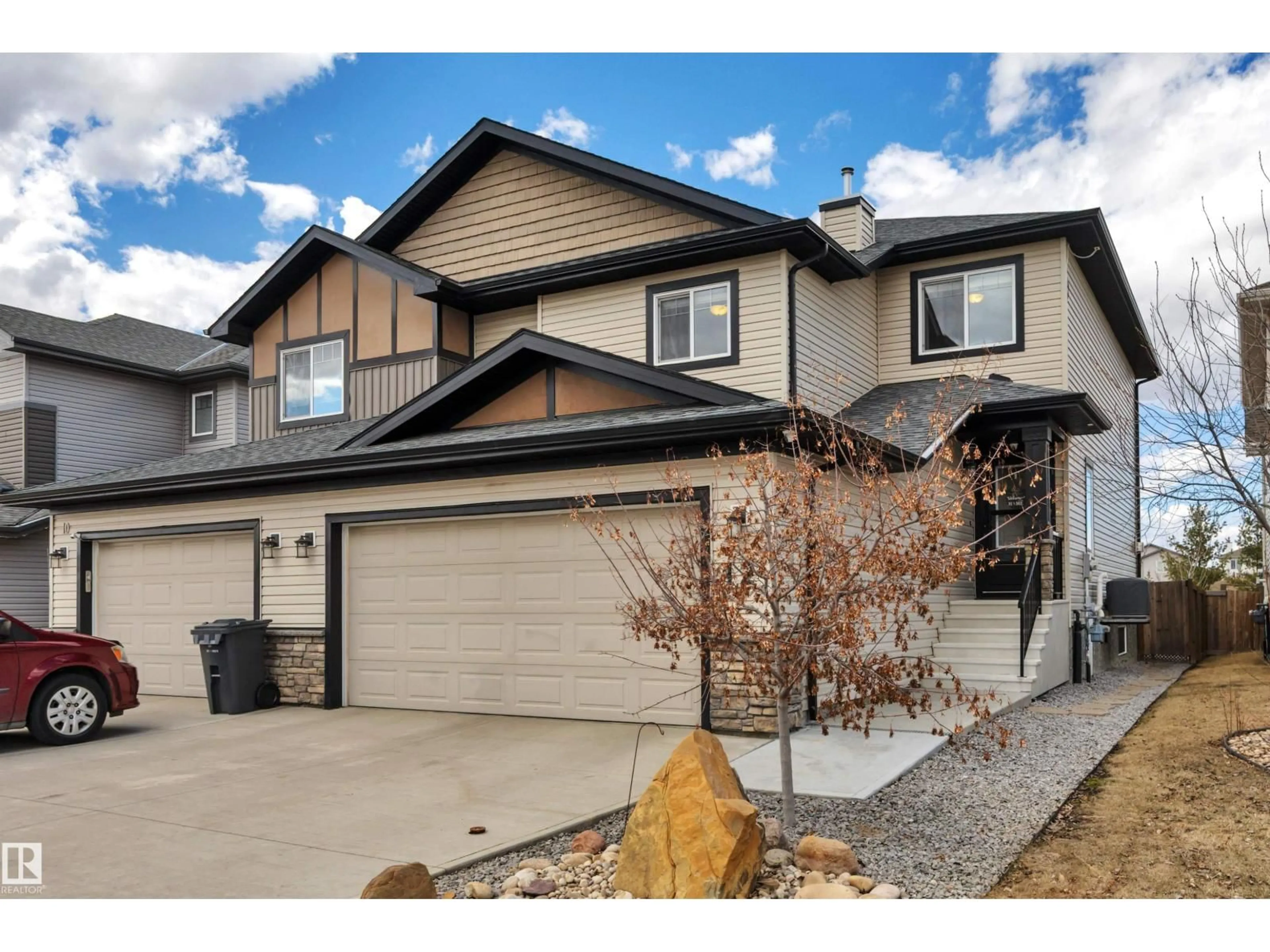 Home with vinyl exterior material, street for 12 MCLEAN, Leduc Alberta T9E1A3