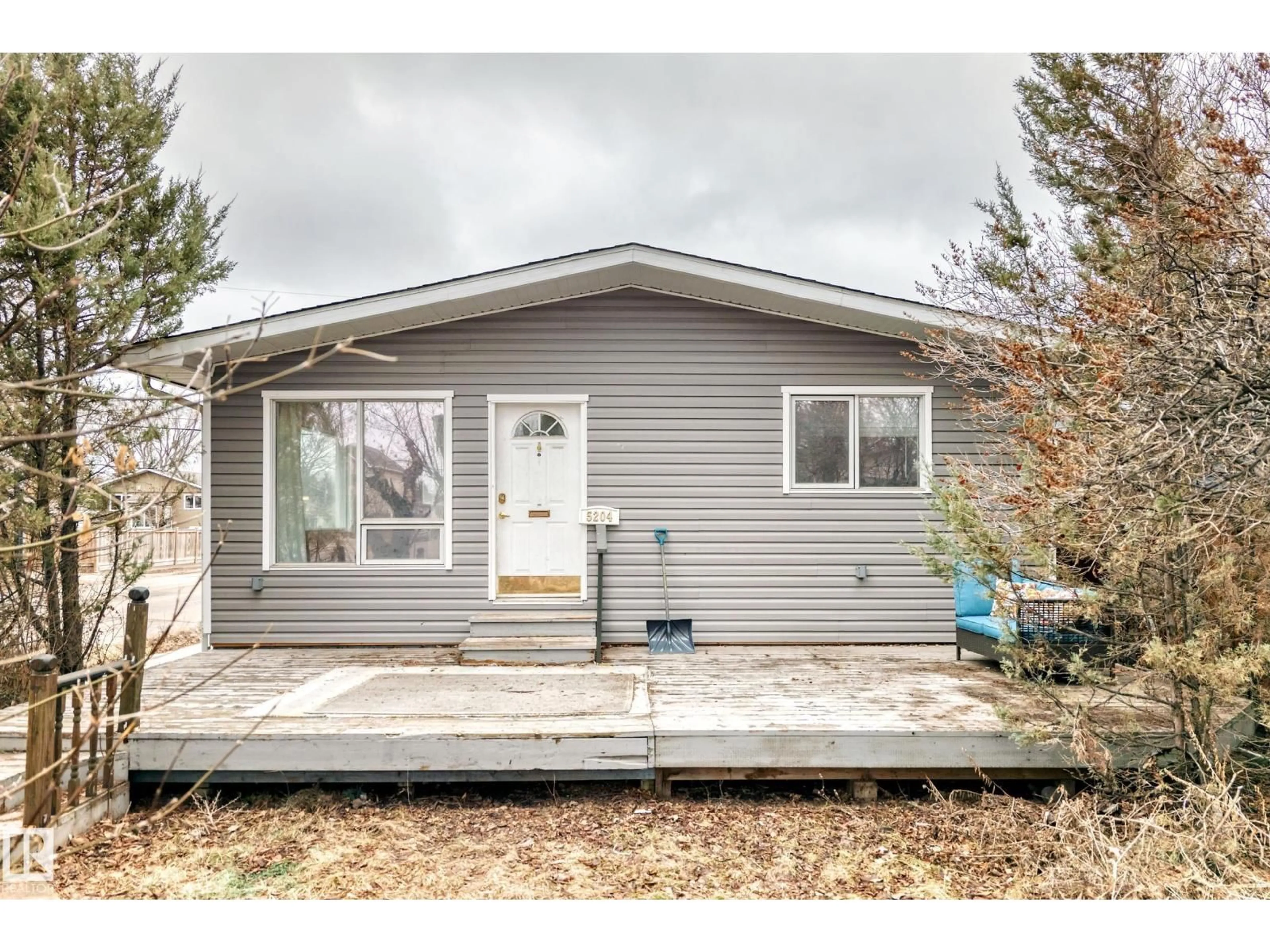 Home with vinyl exterior material, street for 5204 112 AV, Edmonton Alberta T5W0N5