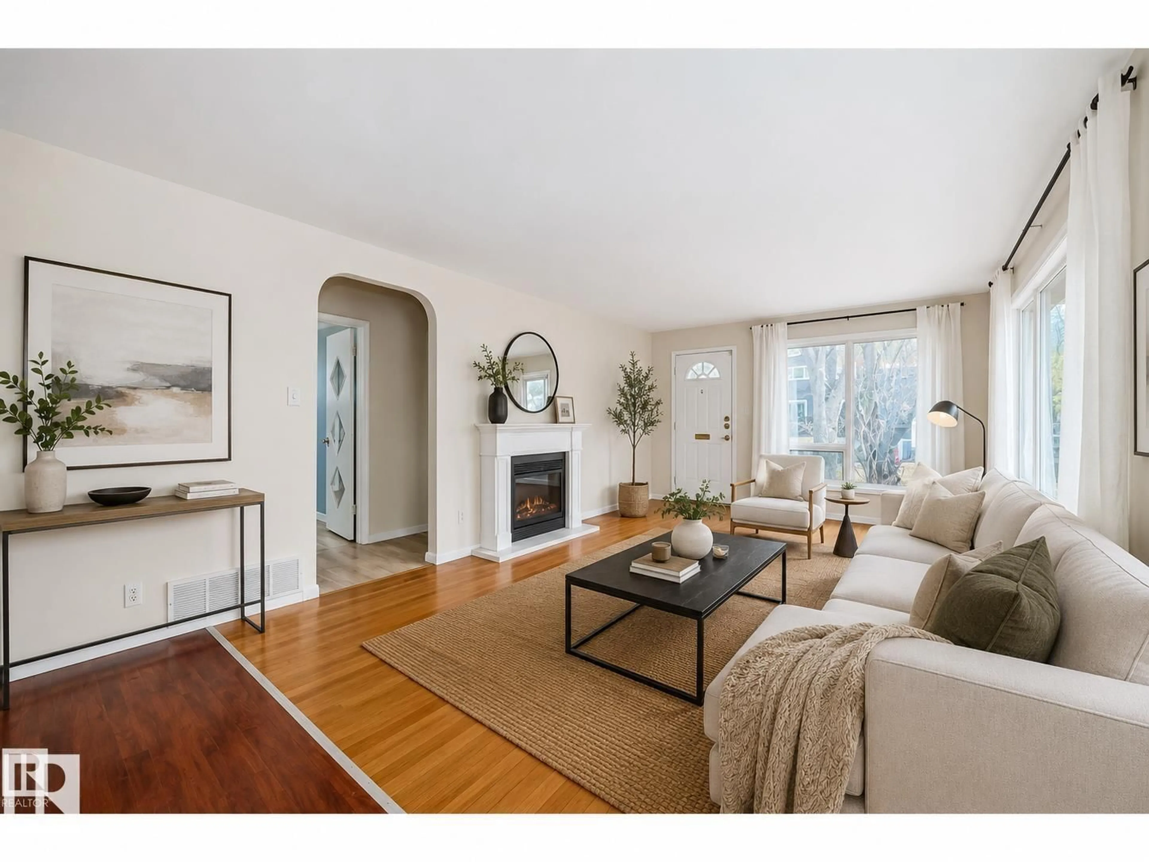 Living room with furniture, wood/laminate floor for 5204 112 AV, Edmonton Alberta T5W0N5
