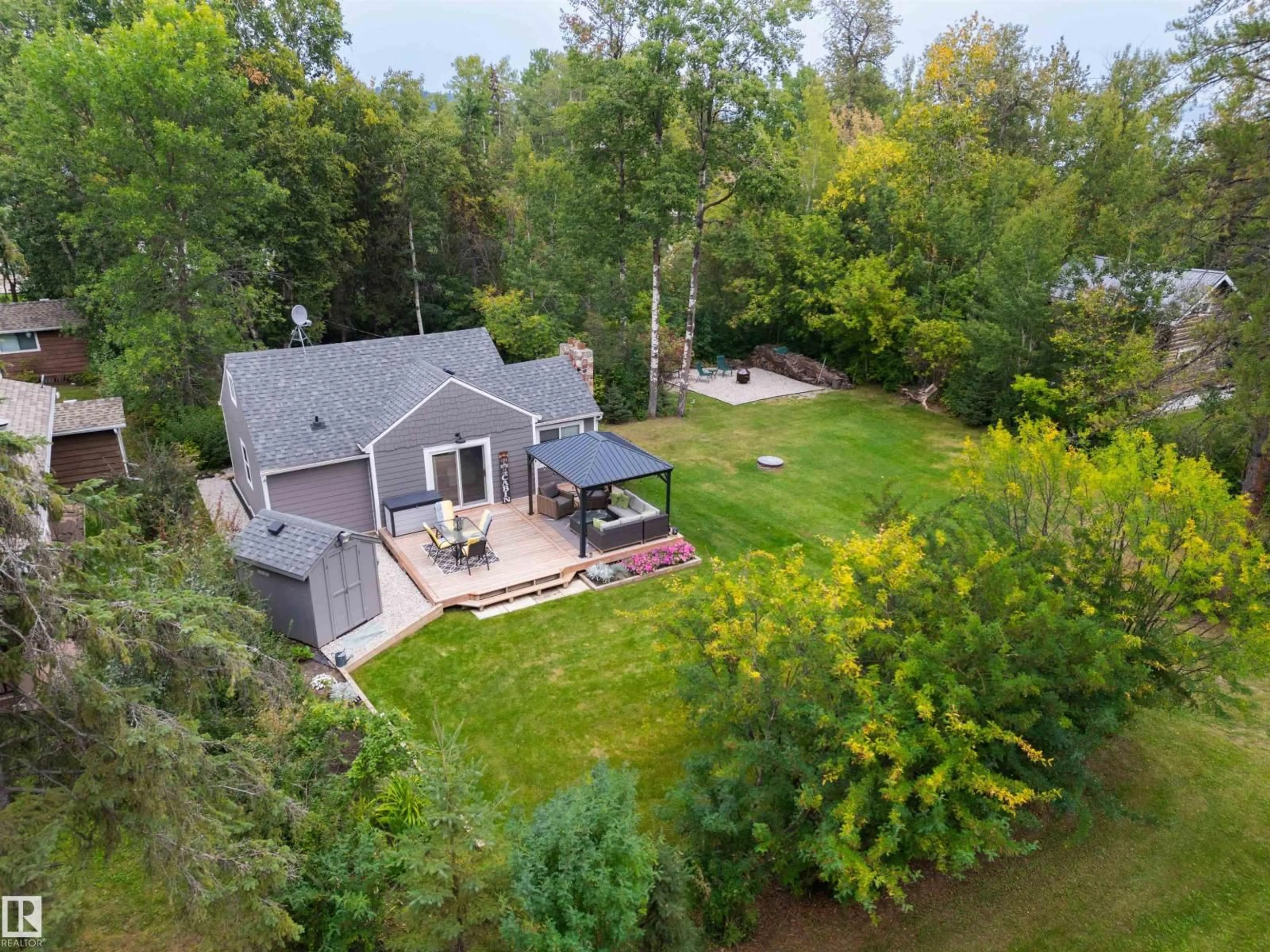 A pic from outside/outdoor area/front of a property/back of a property/a pic from drone, water/lake/river/ocean view for S - 116 & 118 6 STREET, Rural Parkland County Alberta T0E2B0
