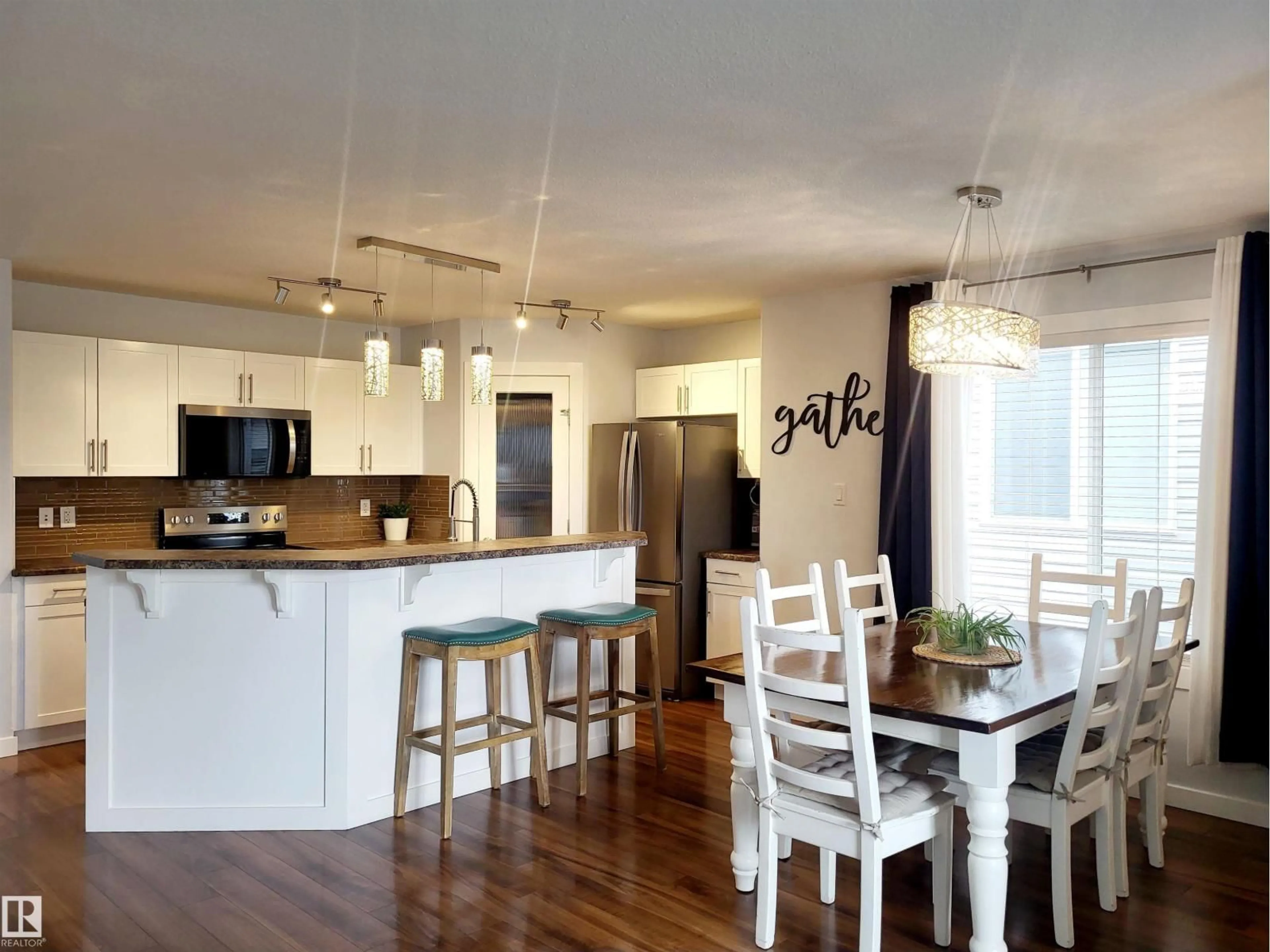 Open concept kitchen, wood/laminate floor for 144 KIRPATRICK WY, Leduc Alberta T9E0Z2