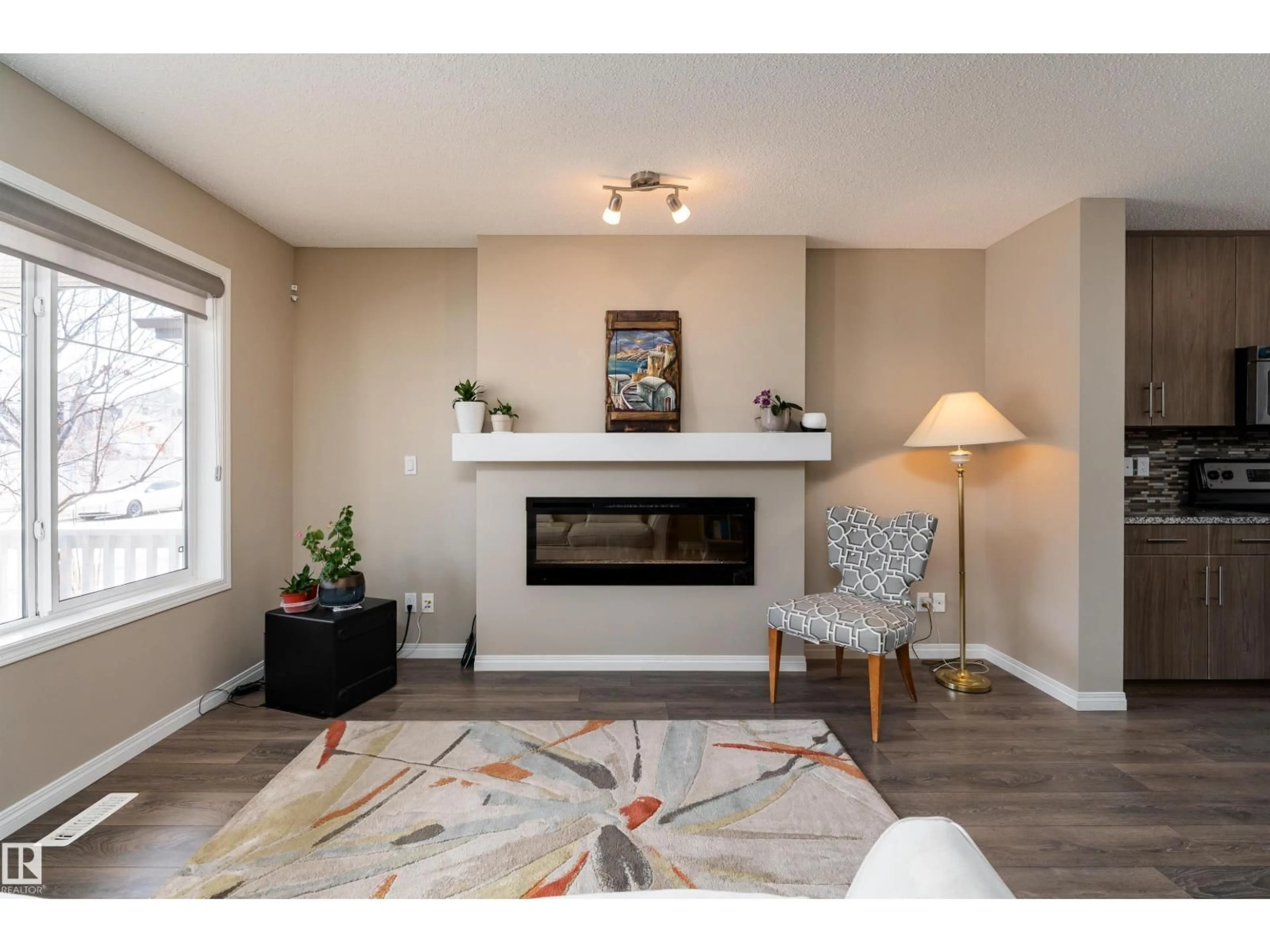 Living room with furniture, wood/laminate floor for SW - 3199 CARPENTER LANDING LD, Edmonton Alberta T6W2Y7