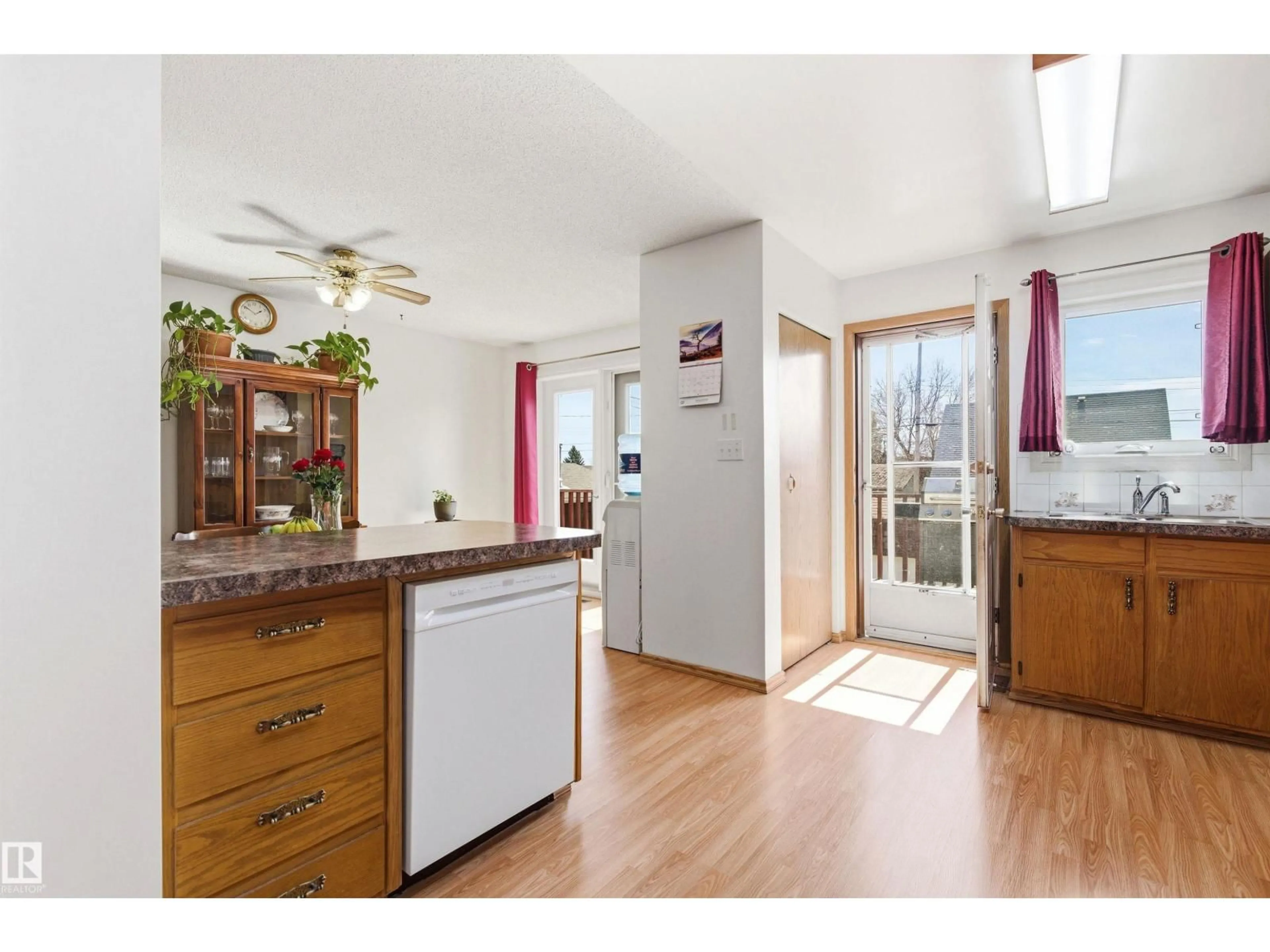 Open concept kitchen, wood/laminate floor for 4509 46 AV, Wetaskiwin Alberta T9A0G8